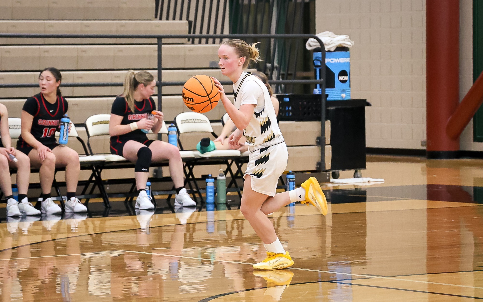 Peyton Tritz brings the ball up the court.