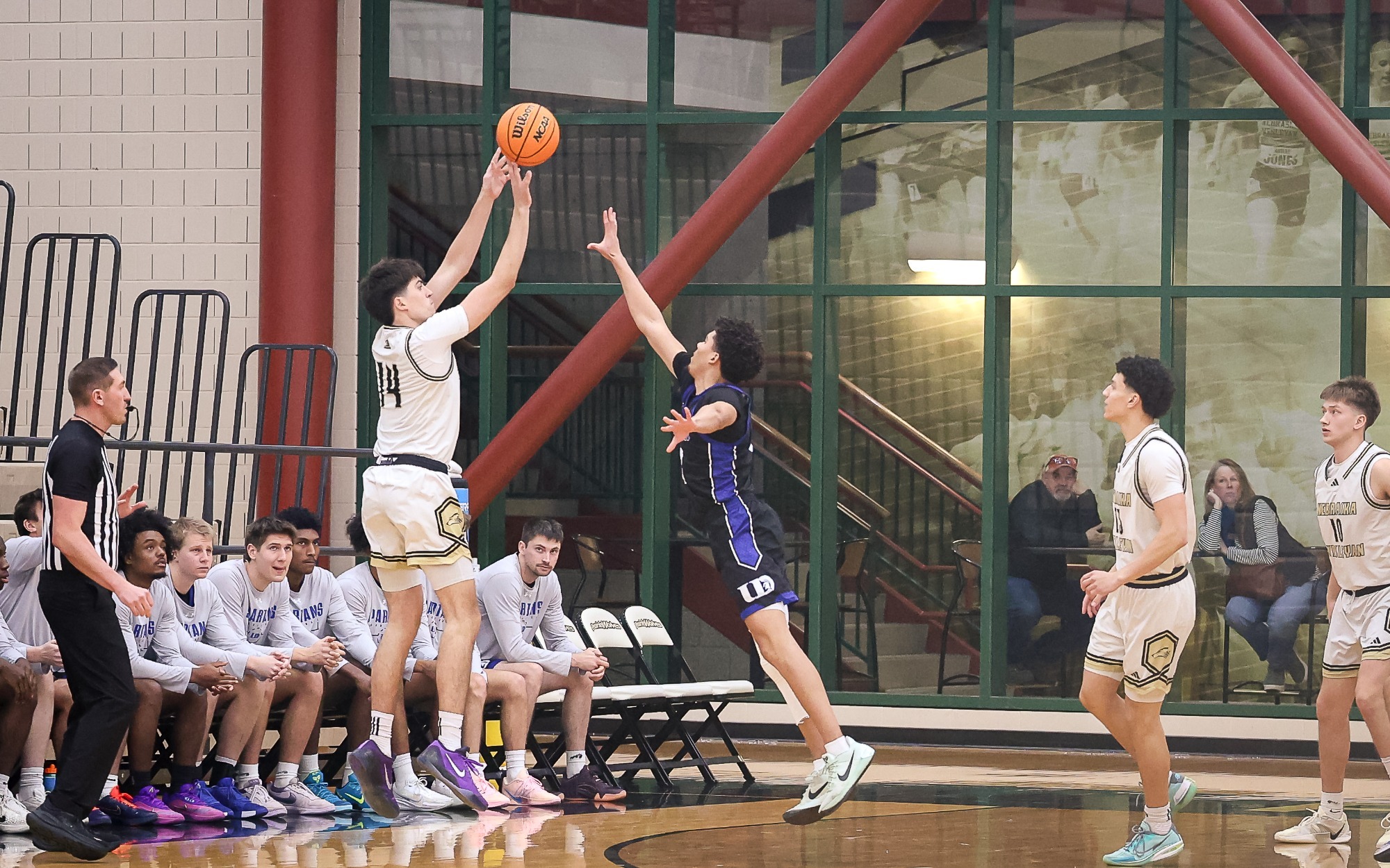 Nick Howard shoots a three over a Dubuque defender