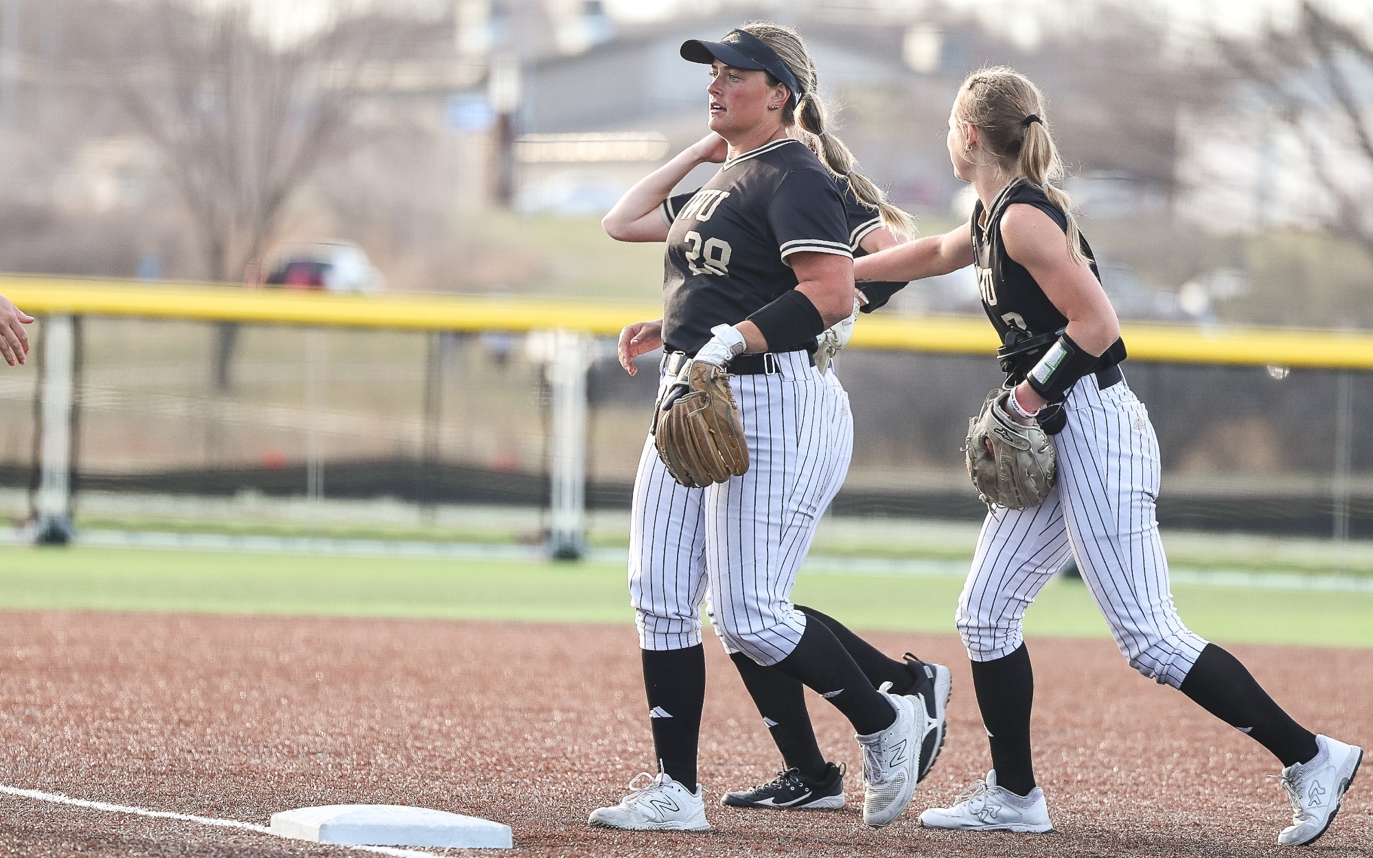 Jenna Kimberling and teammates jog off of the field