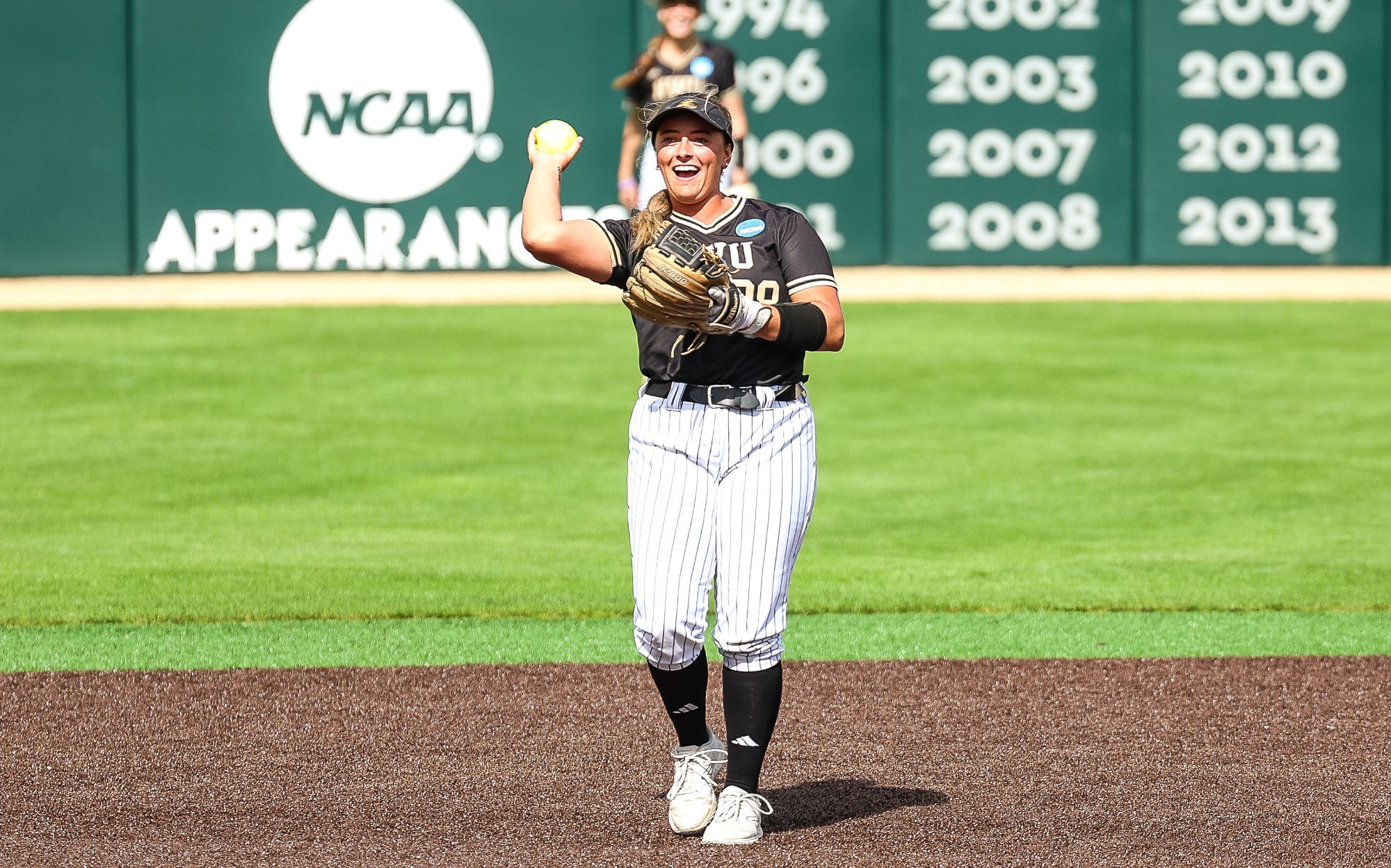 Jenna Kimberling throws the ball back to the pitcher