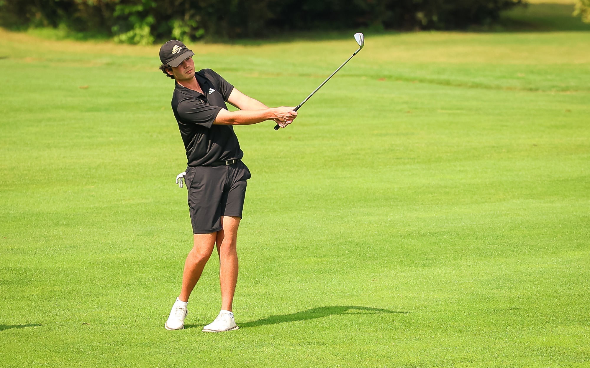 Jackson Lapour drives a ball onto the green.