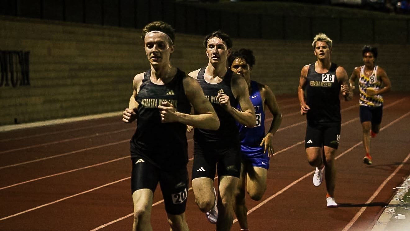 Evan Brown, Dylan Lender, and Lawson Tjardes rounds the corner in the 5000 meter