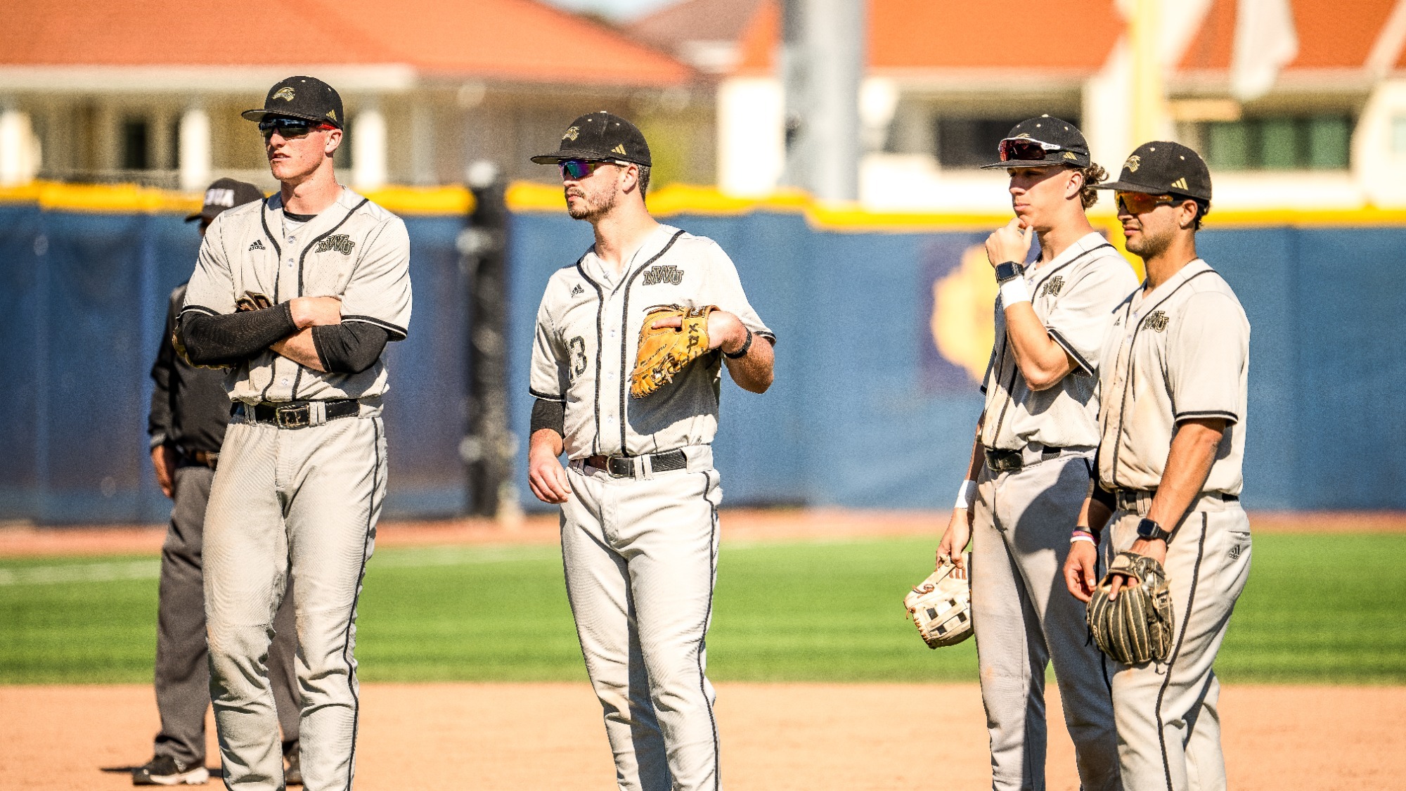Infielders watch pitcher warmup in Florida