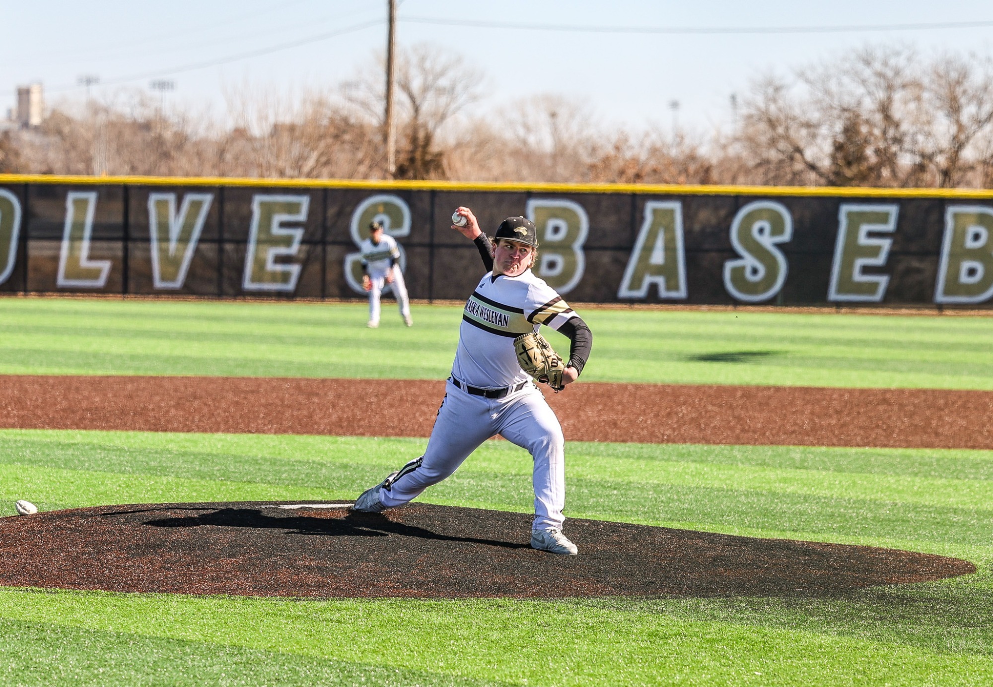 Garrett Walsh throws a pitch towards home plate