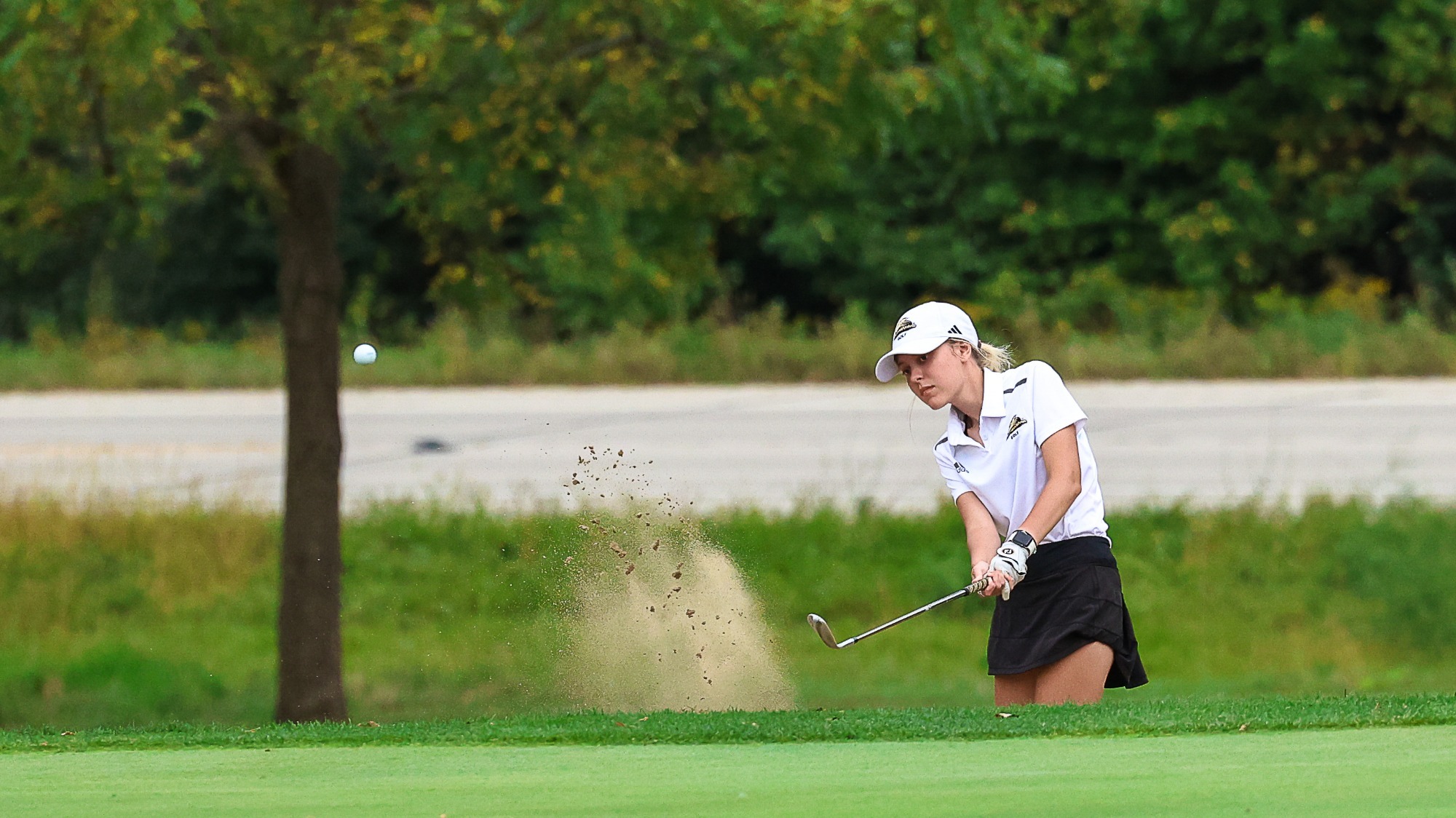 Shea Meridith chips a shot out of the bunker