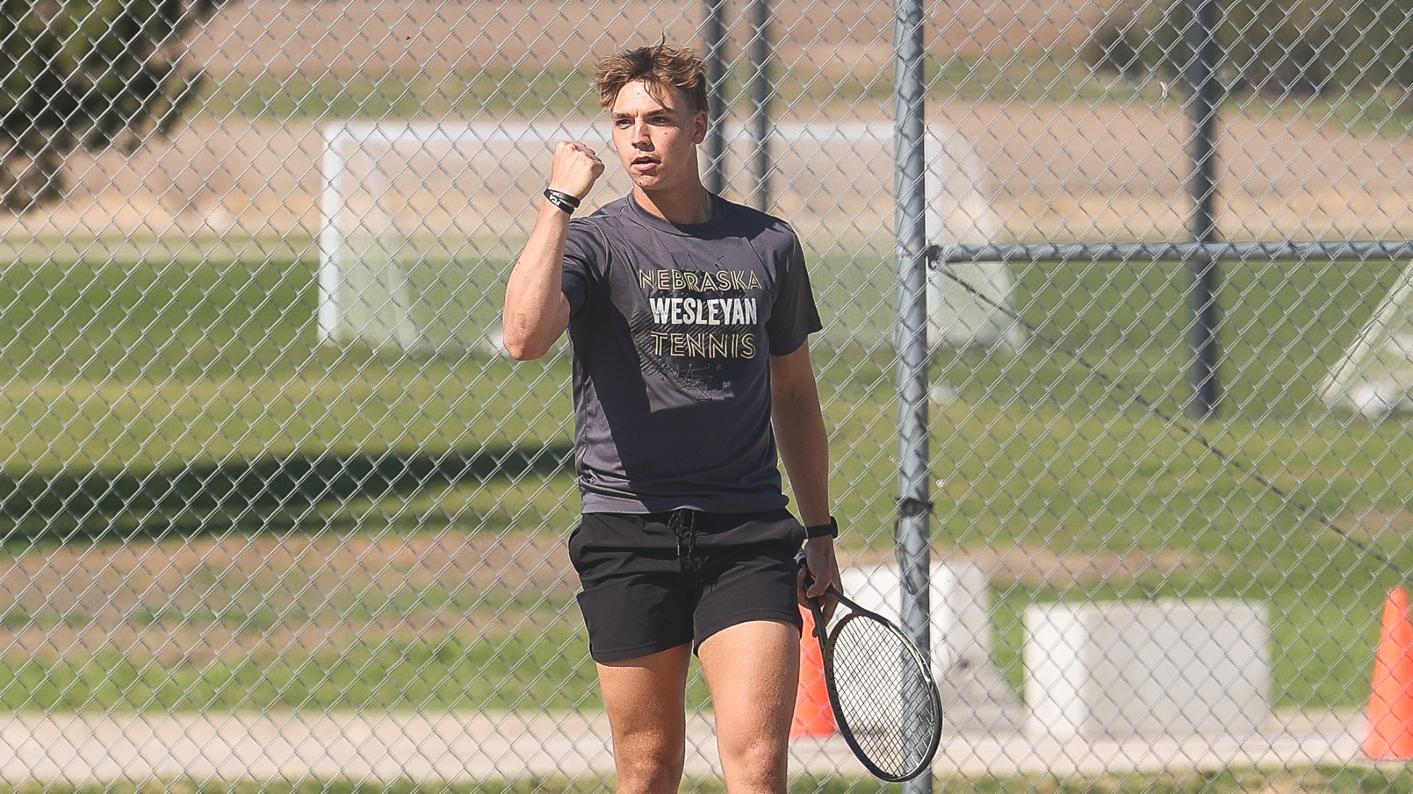 Gavin Nichols pumps his fist in celebration after a big point