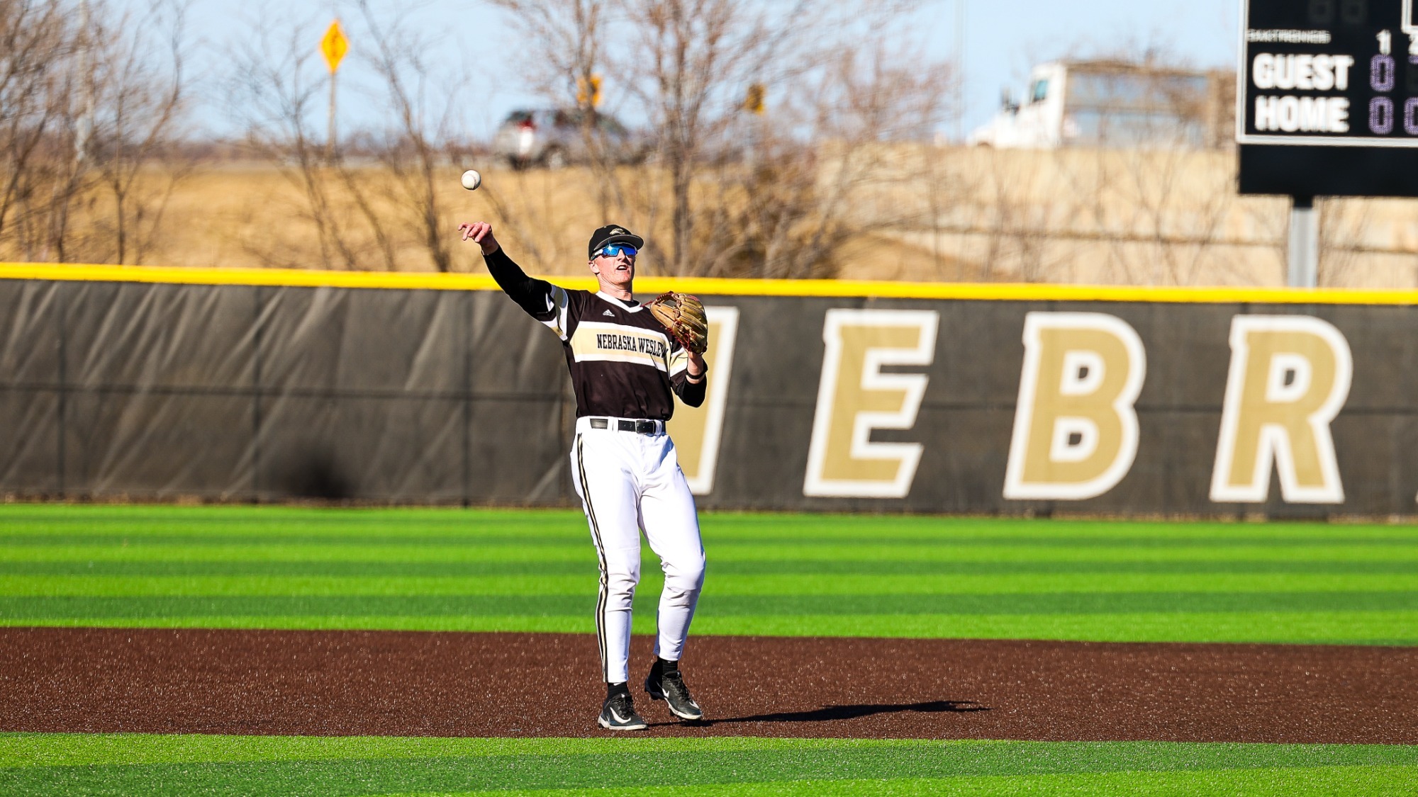 Easton Johnson tosses a ball back to the pitcher after making a catch