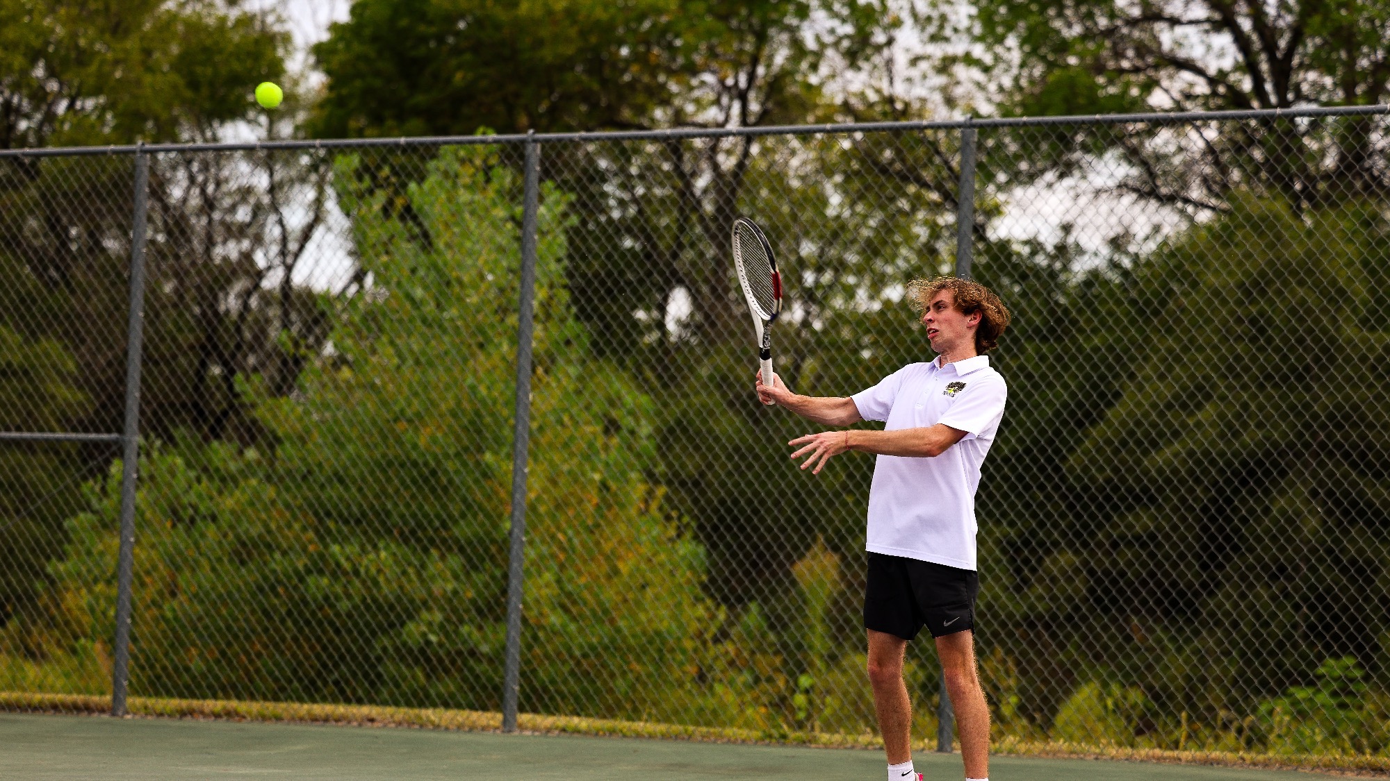 Sam Rademacher serves a big swing