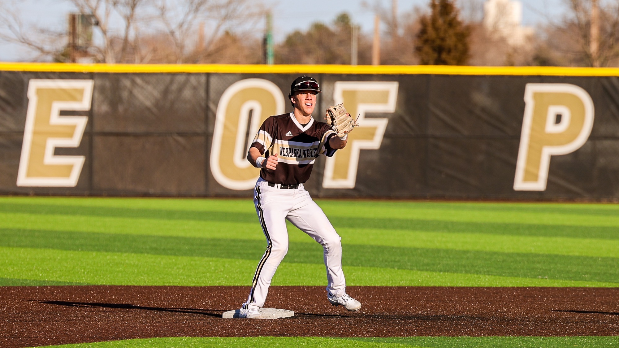 Jaxon Volkmer turns a double play at second base