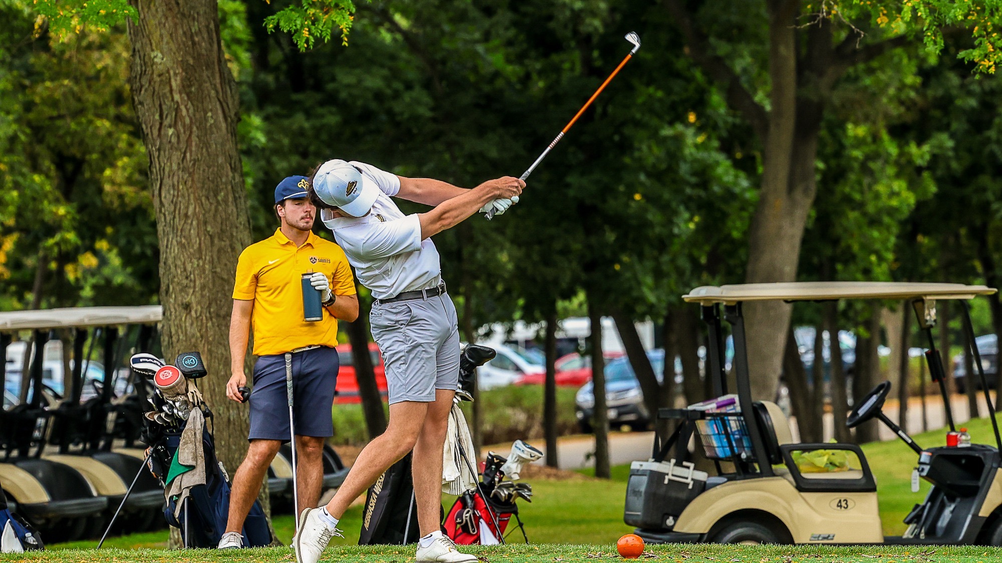 Jackson Lapour swings an iron off the tee box