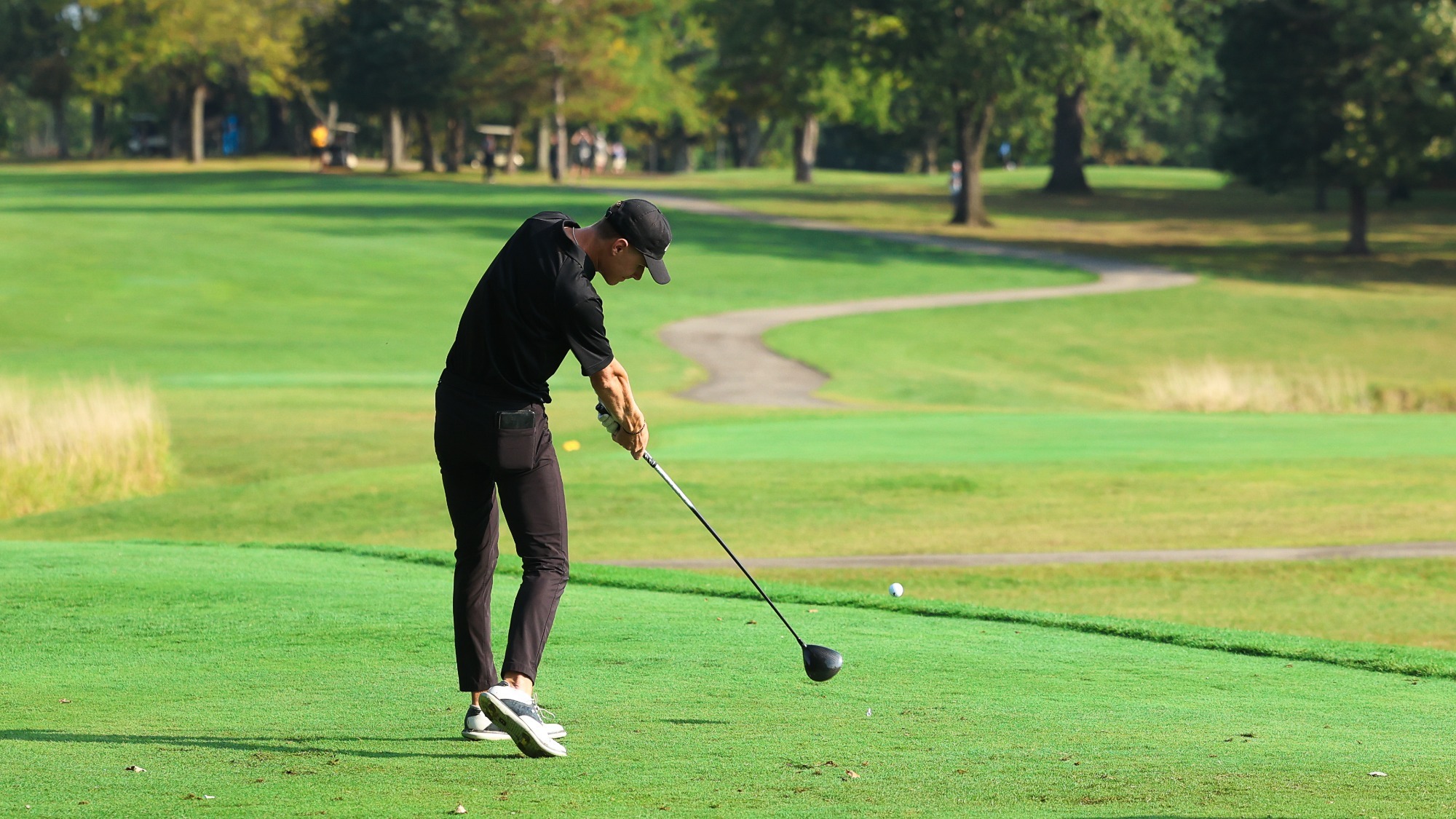 Brayden Schram drives a ball off the tee
