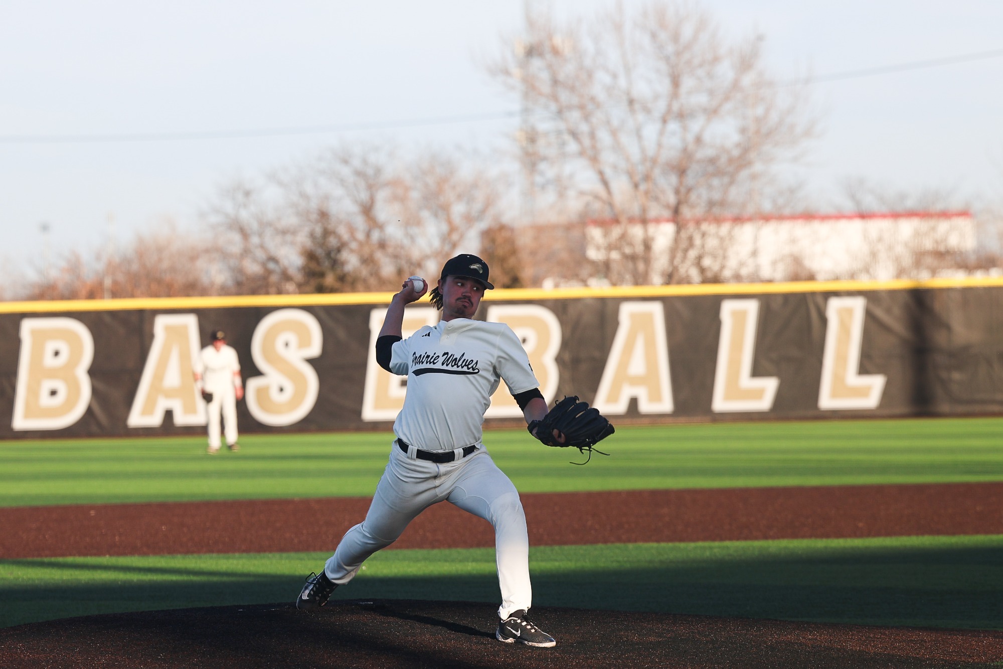 Jack Starr throws a pitch to the plate against Luther