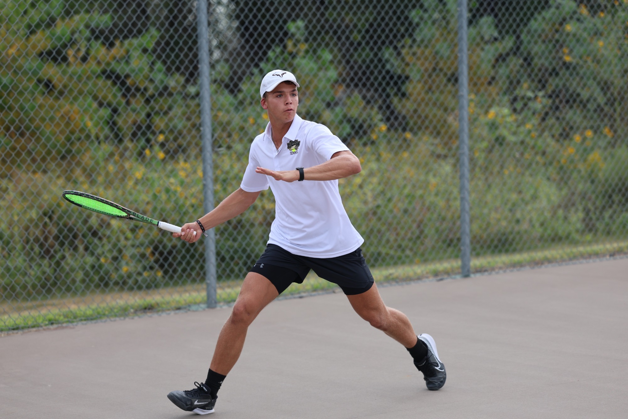 Gavin Nichols returns a serve