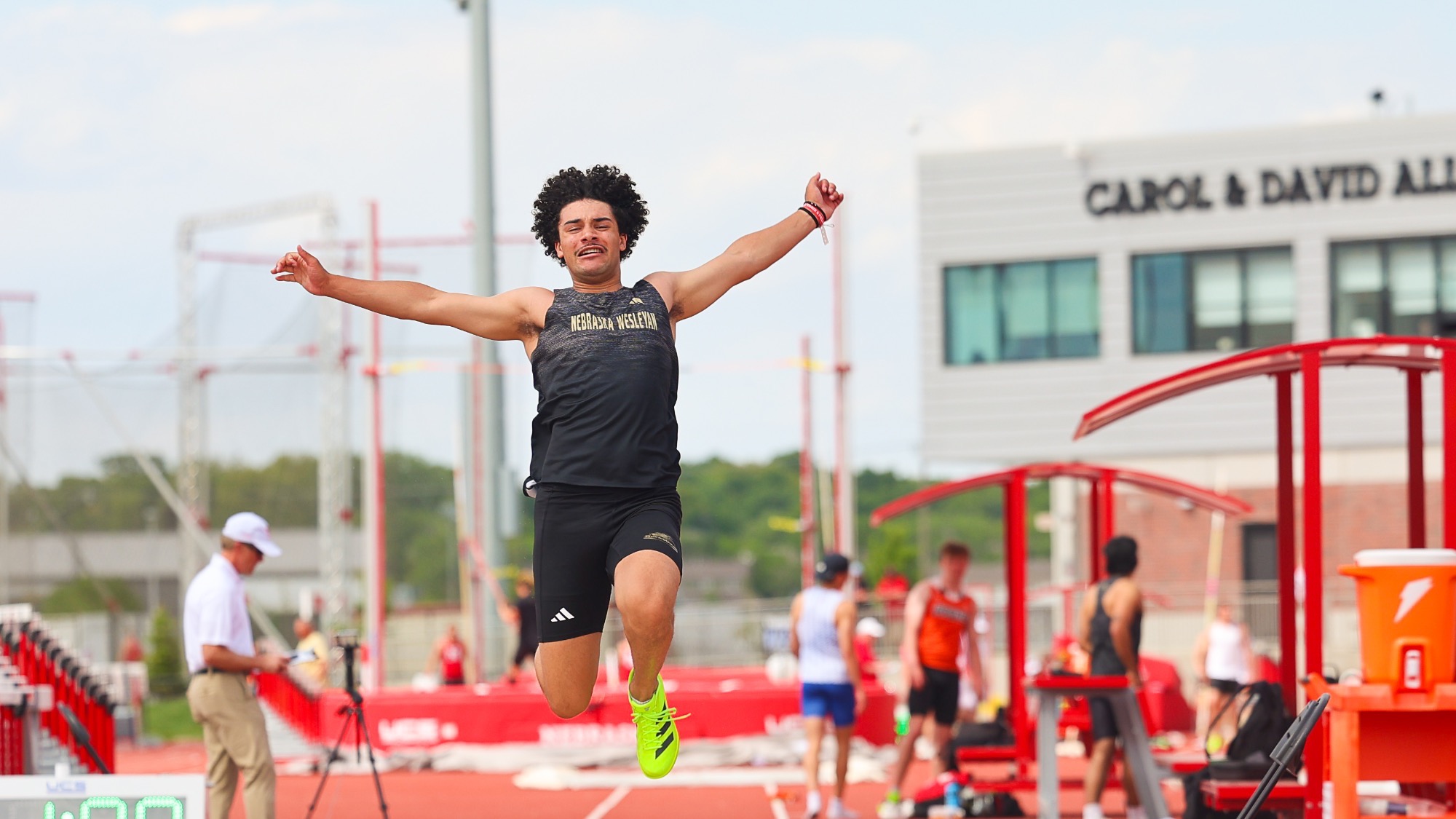 Jonah Amill flies through the air in the long jump