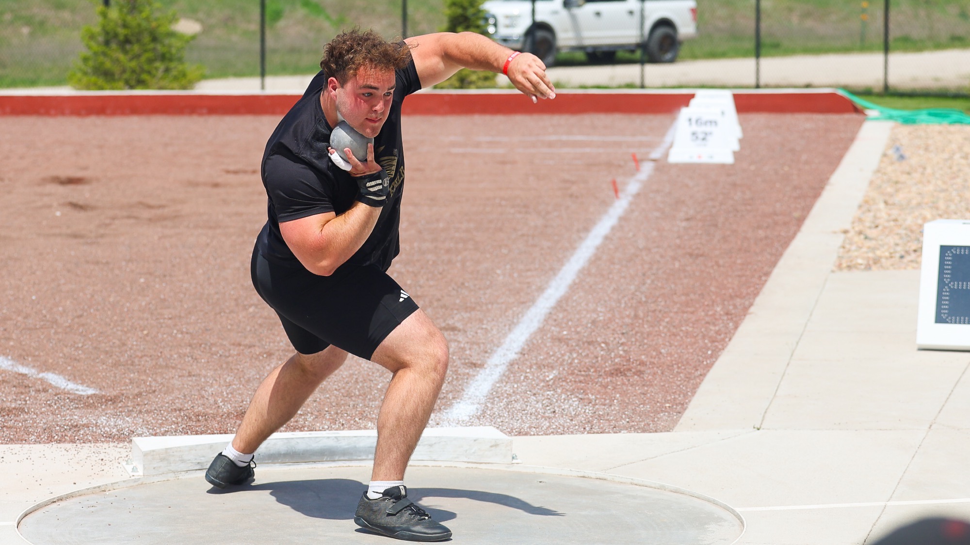 Sam Clements warms up for the shot put competition at the University of Nebraska