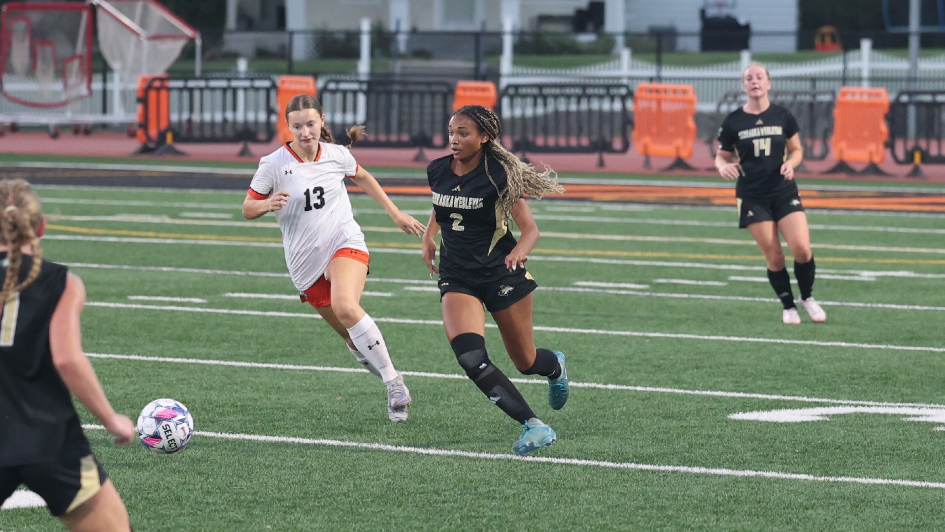 Jaiah Arthur chases down a ball in the midfield