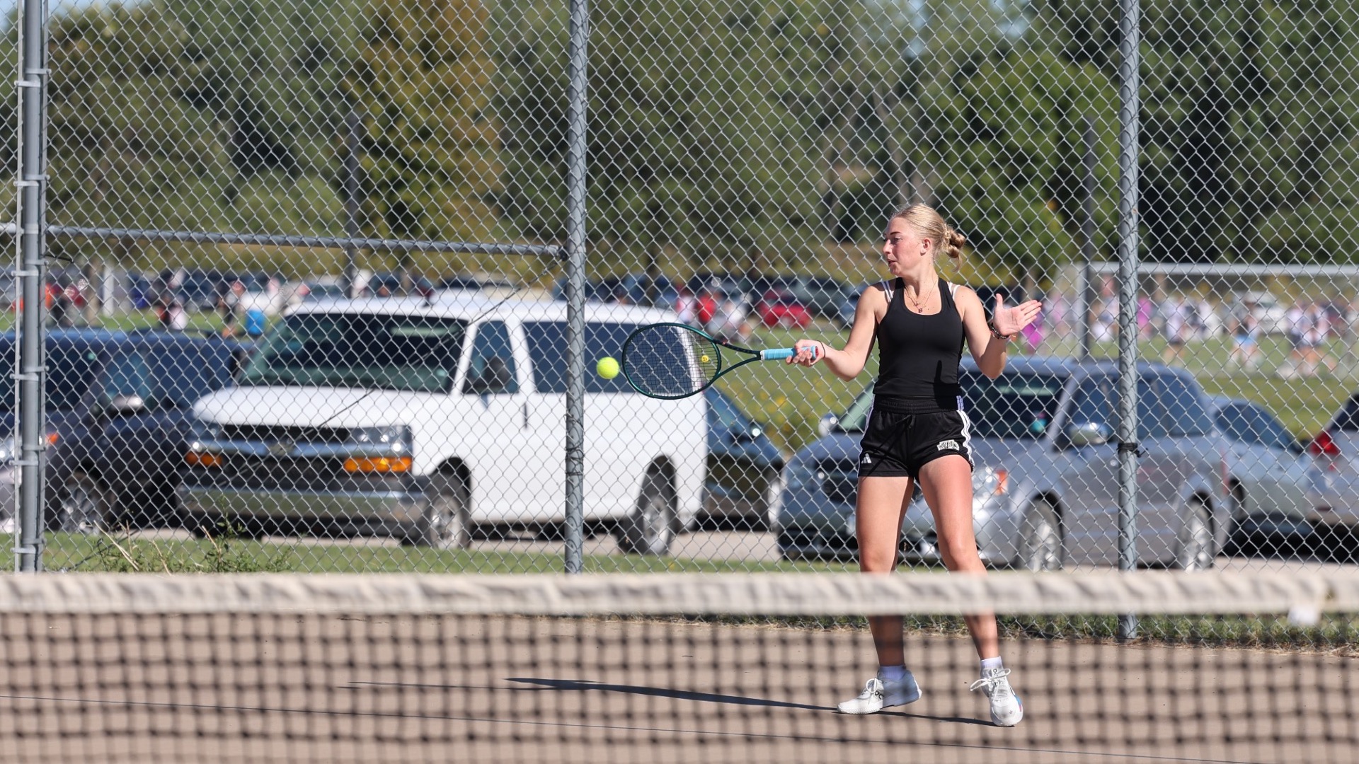 Kylie Engelsman swings the ball across the net