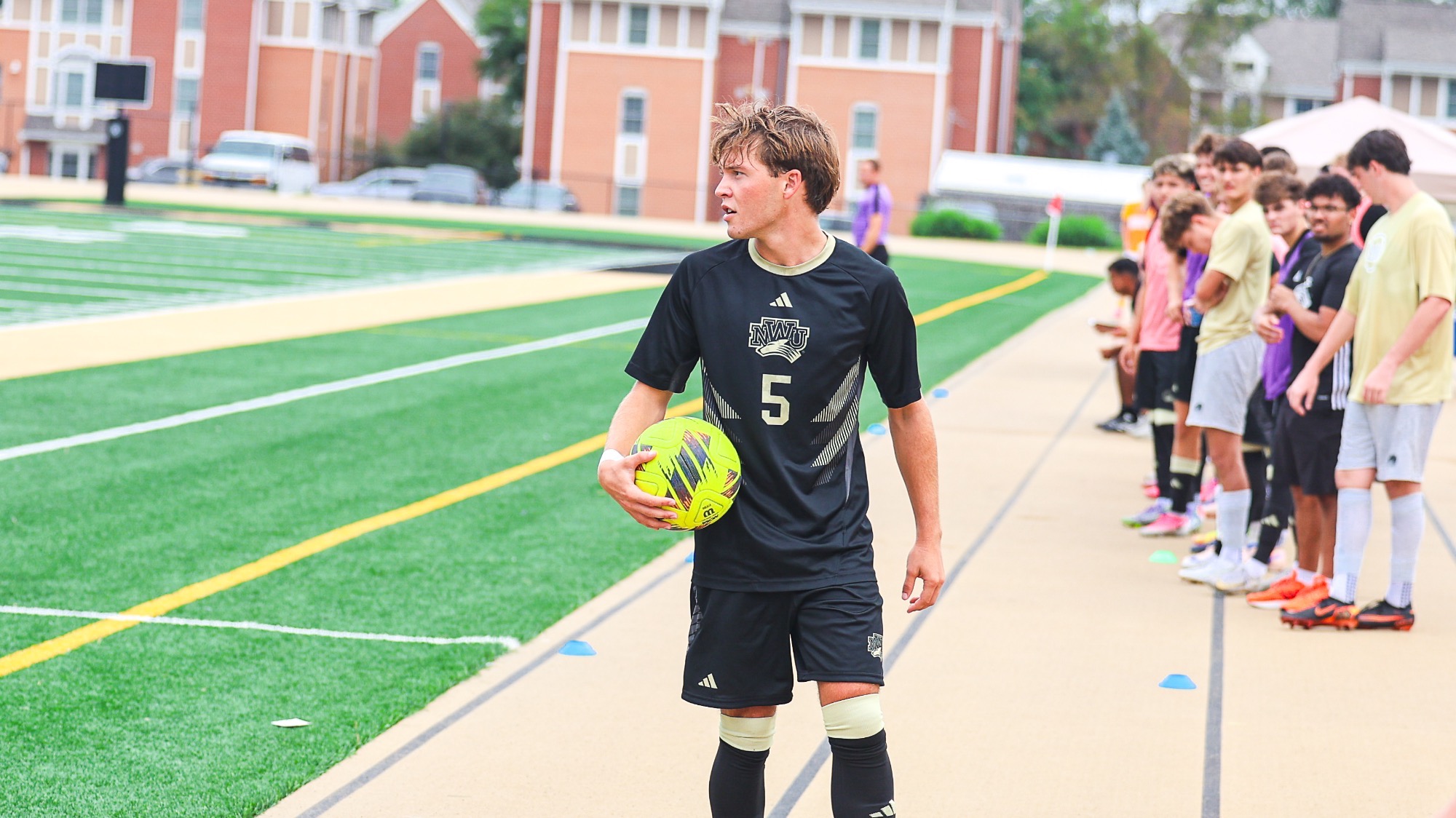 Thomas Pisasale prepares to throw the ball in from the home sideline