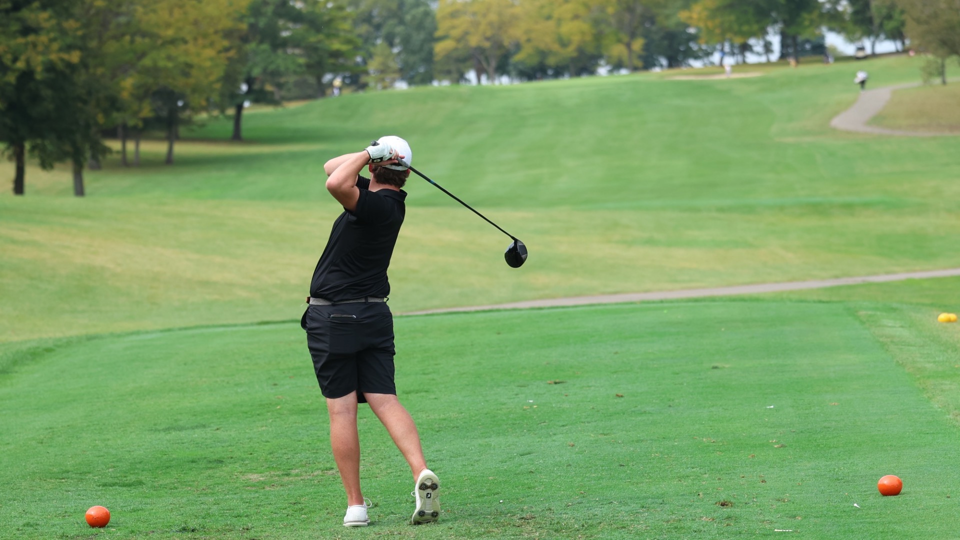 Jacob Cosimano drives a ball down the fairway