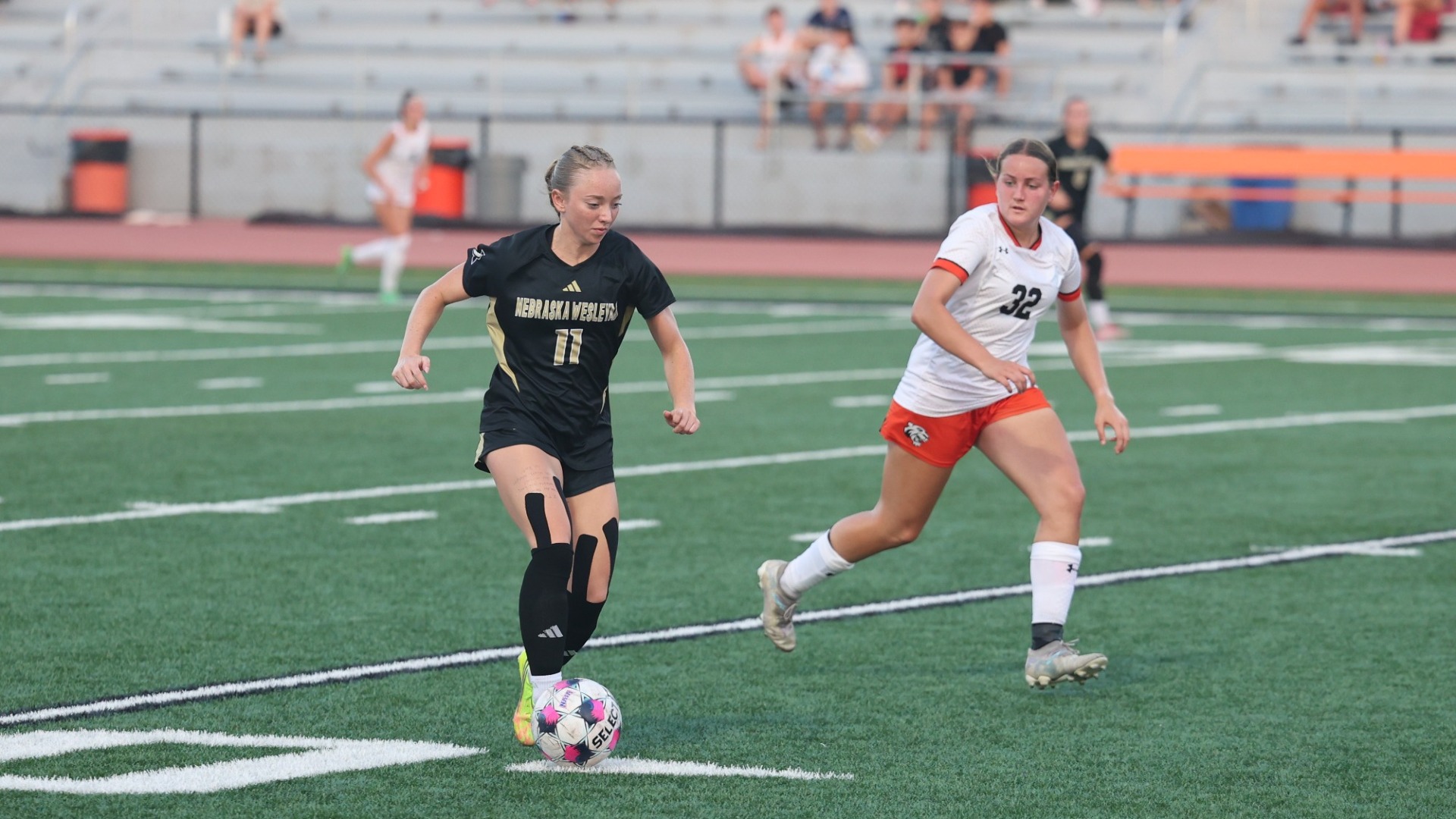 Ava Reed dribbles the ball downfield