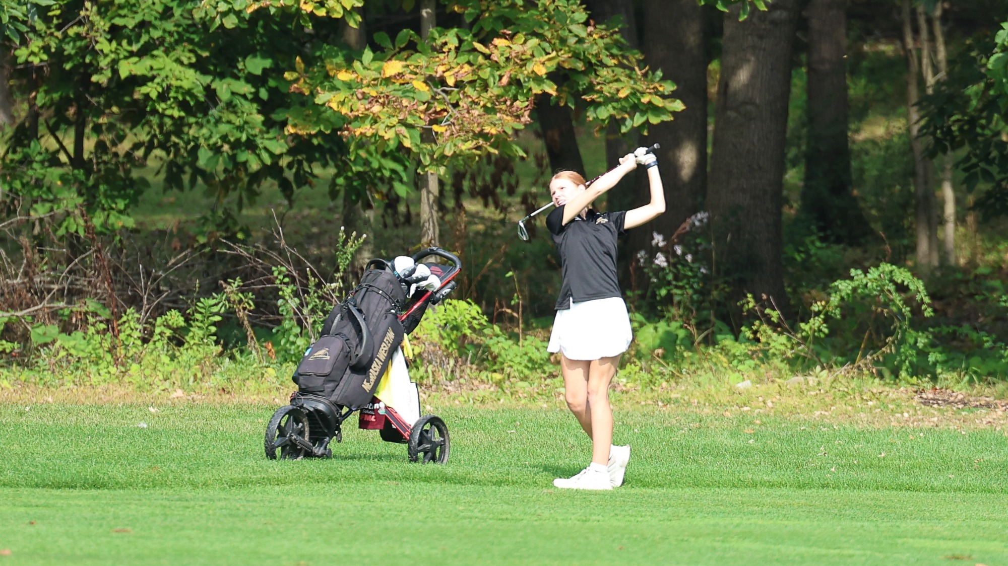 Lauren Hays drives a ball in the fairway