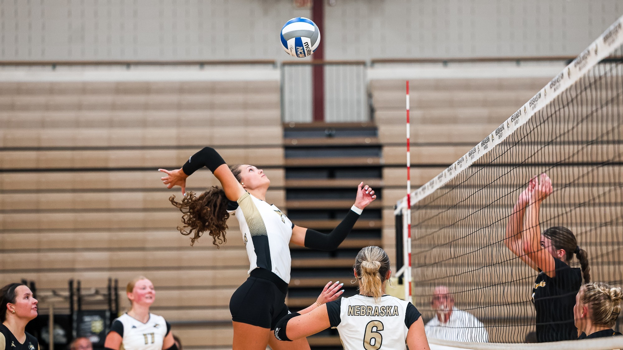 Ella Foote swings high for a kill against NPCC