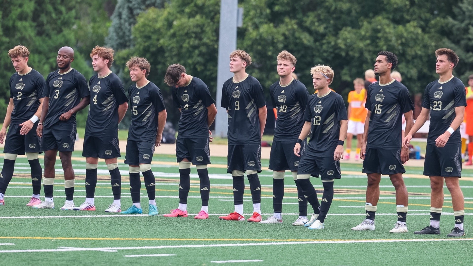 The men's soccer Starting Lineup stands in a line