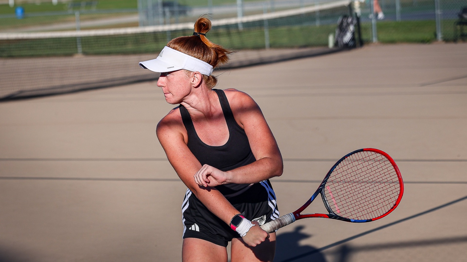 Sylvia Kamradt tracks down a ball and returns it backhand
