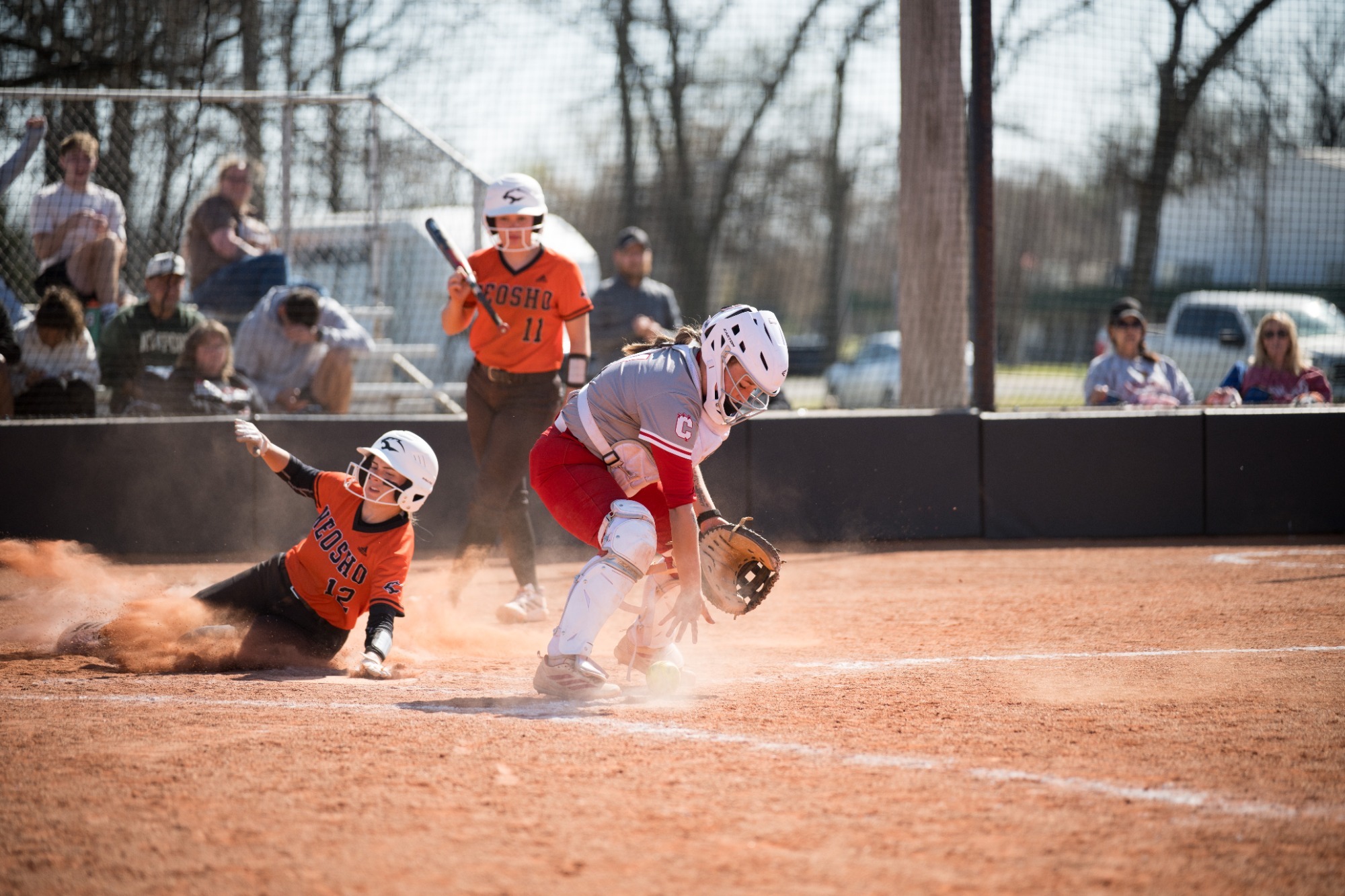 #12 for Neosho Sliding Into Home Plate Safe while Coffeyville Catcher Drops the ball
