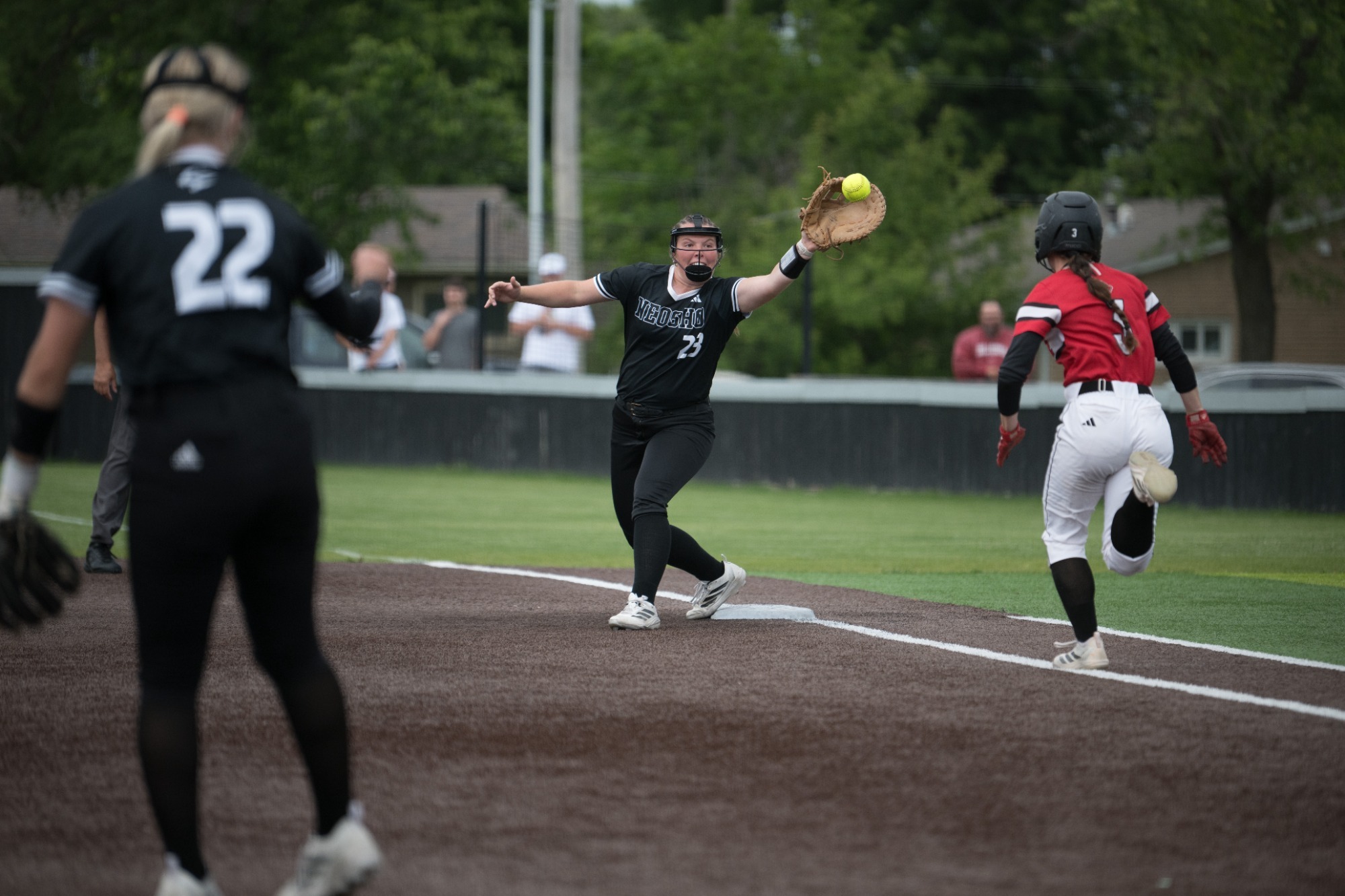 Neosho First Base Player Lunges to Catch ball before opponent gets to the base