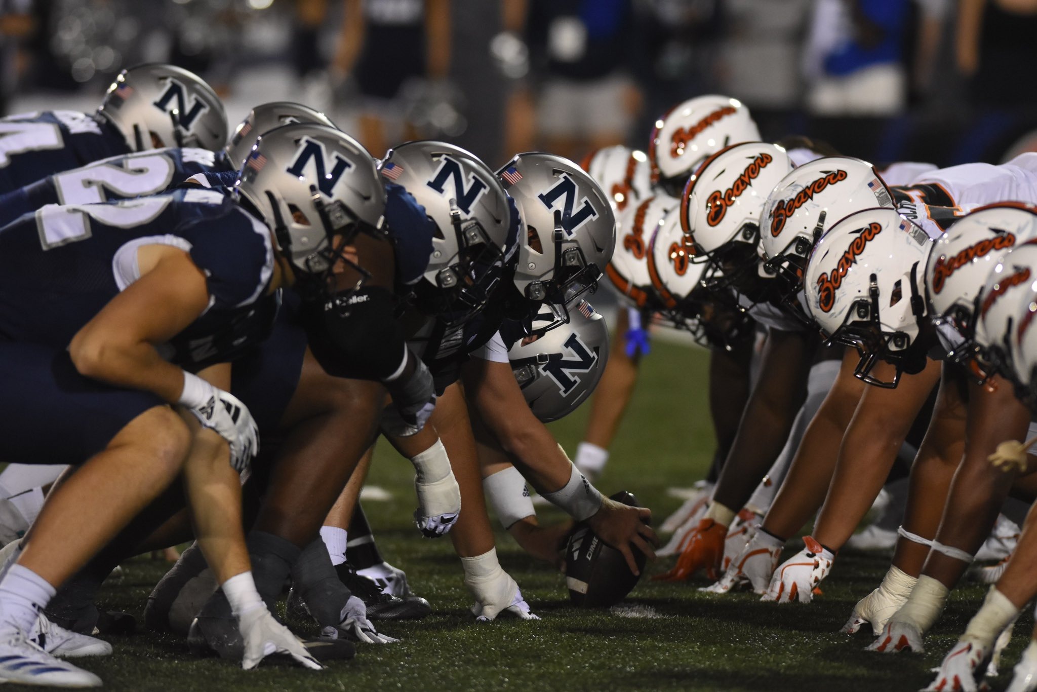 Nevada and Oregon State players lined up head-to-head at the line of scrimmage