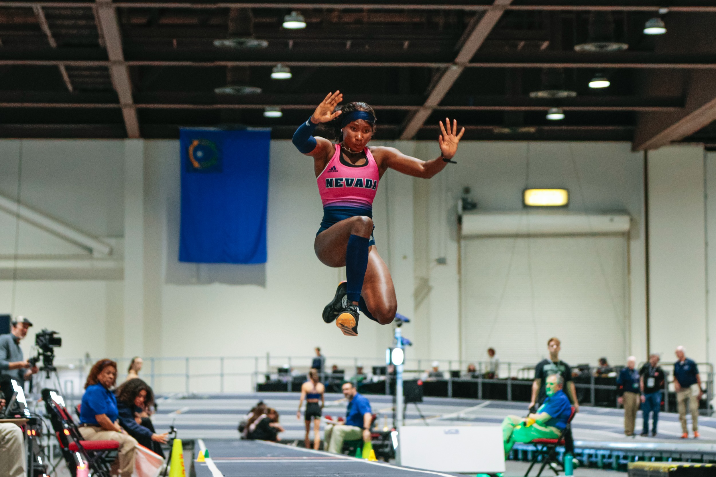 Meekness Dogonyaro mid-air in a Triple Jump attempt
