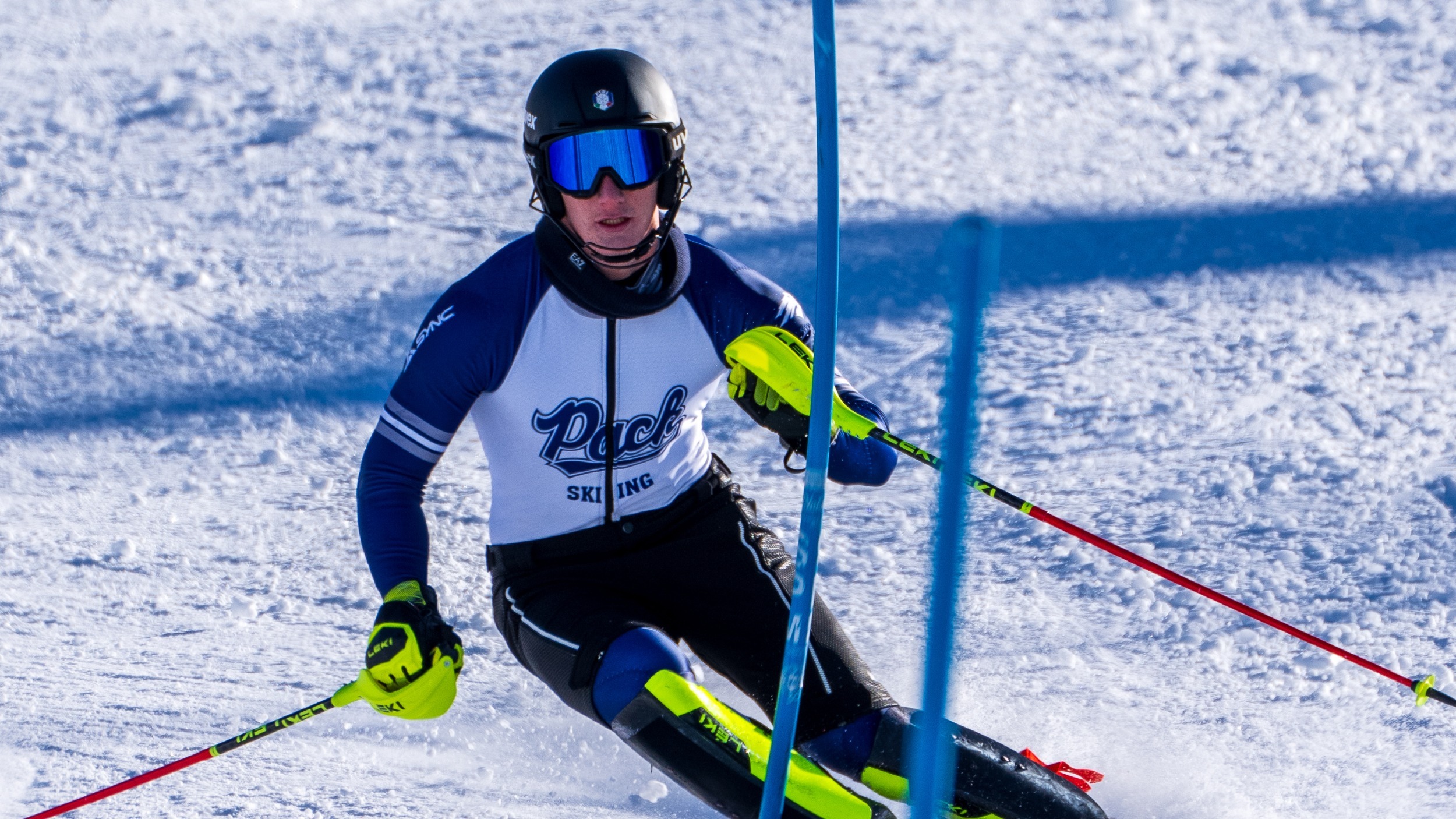 Pietro Bisello skis around a slalom pole