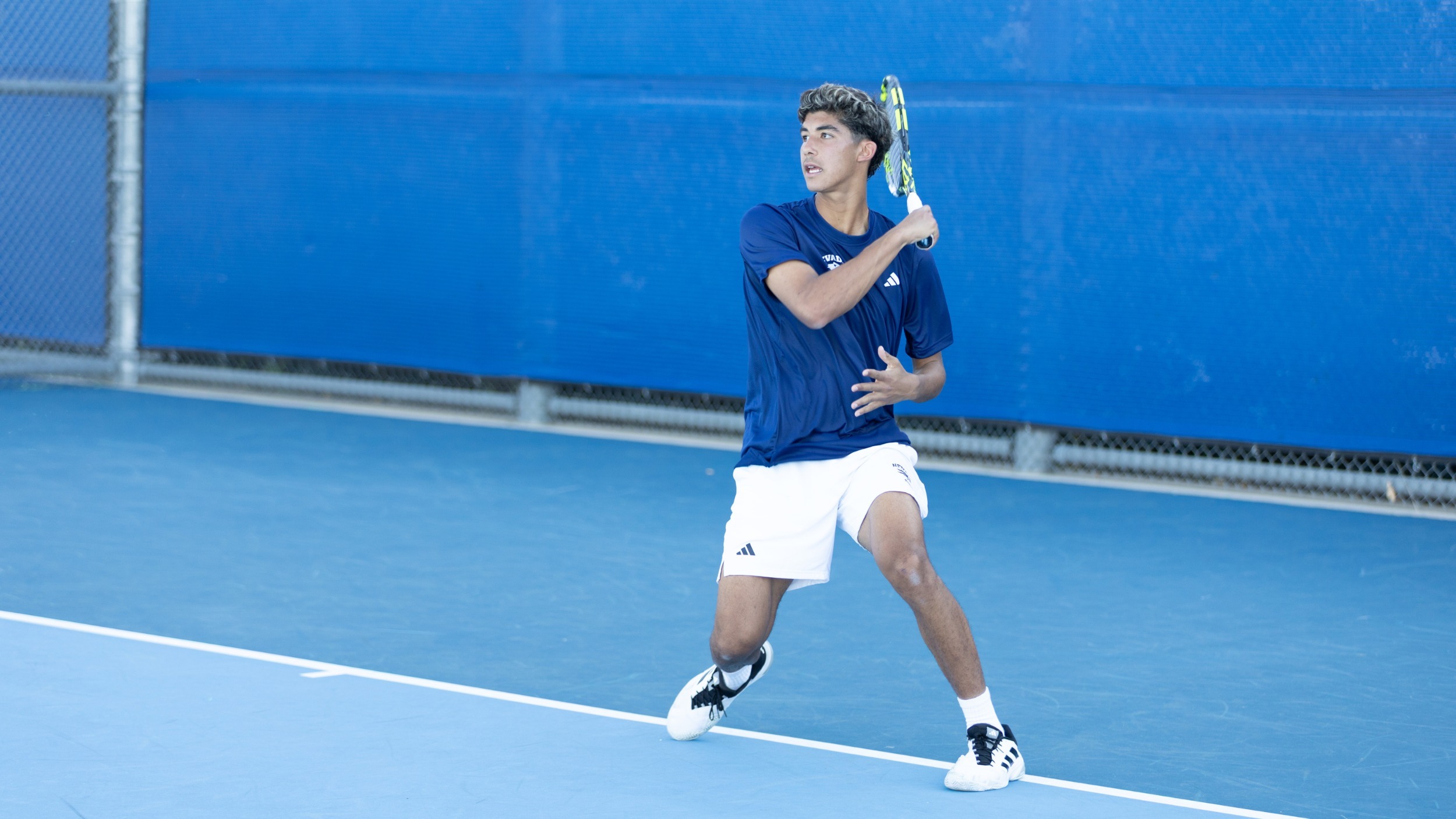 Ibrahim Snoussi returns a volley in a tennis match