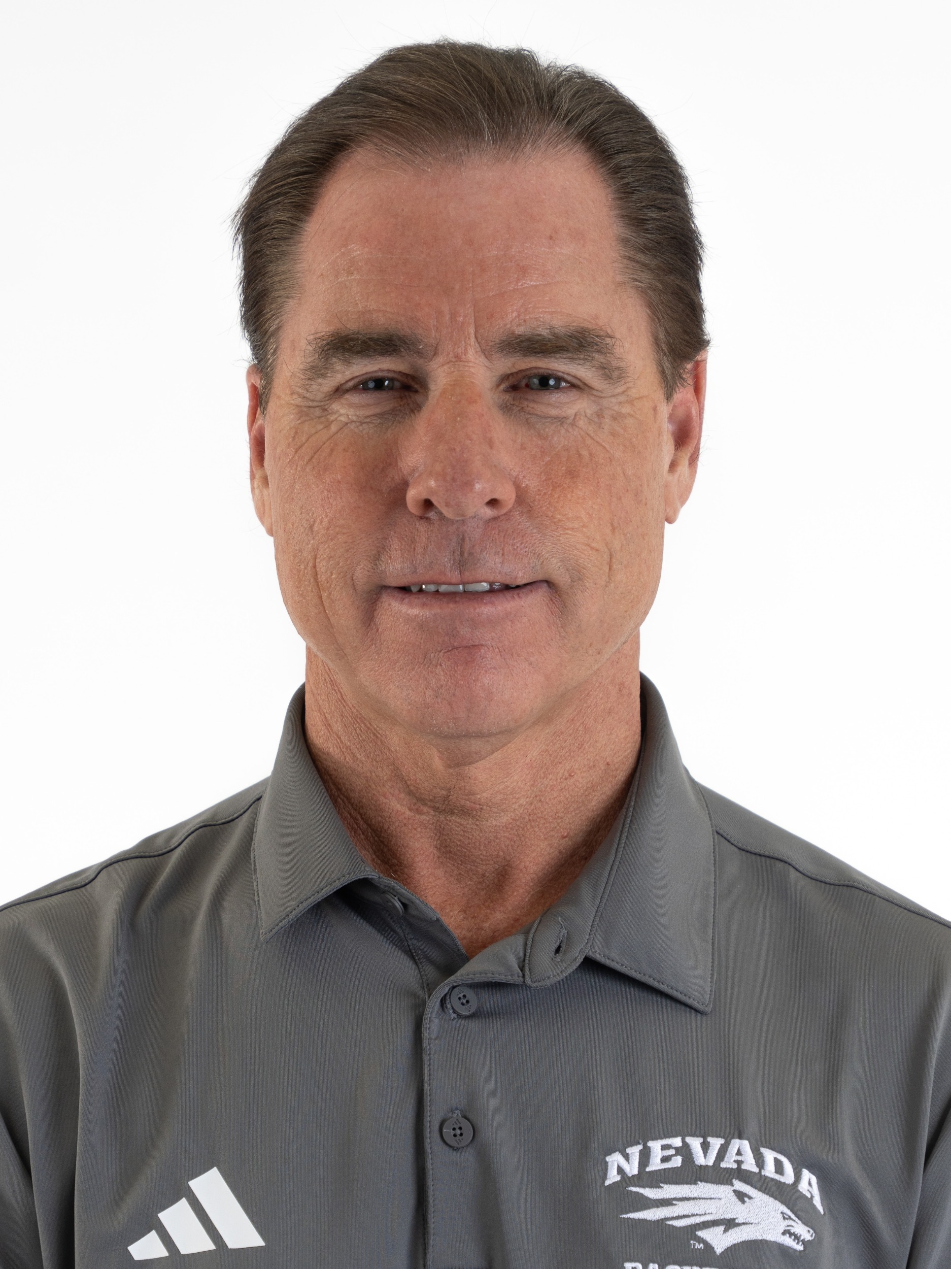 Headshot of Kelly Sopak in gray polo shirt