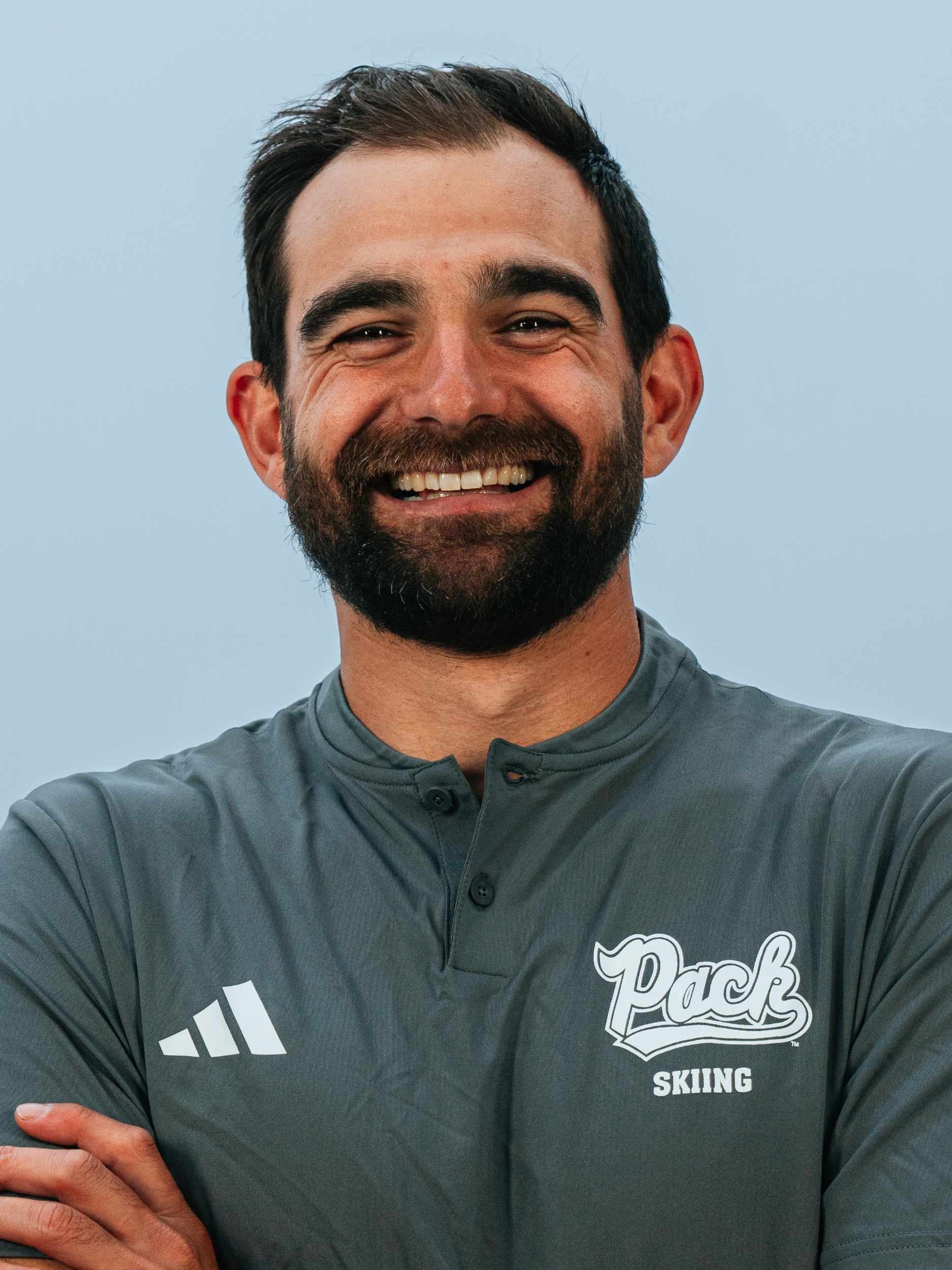 Headshot of Nico Monforte in gray shirt