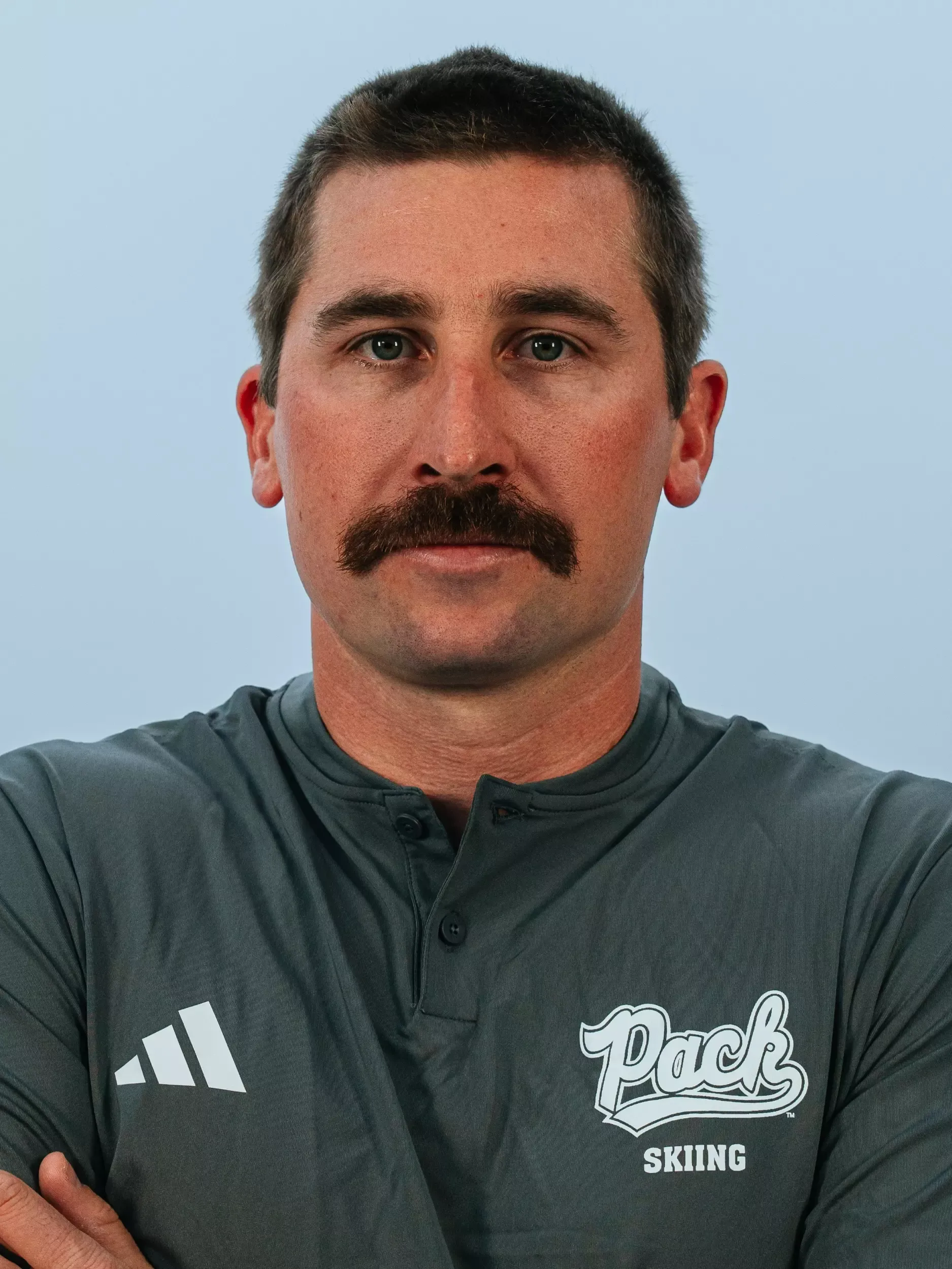 Cameron Smith headshot in gray shirt