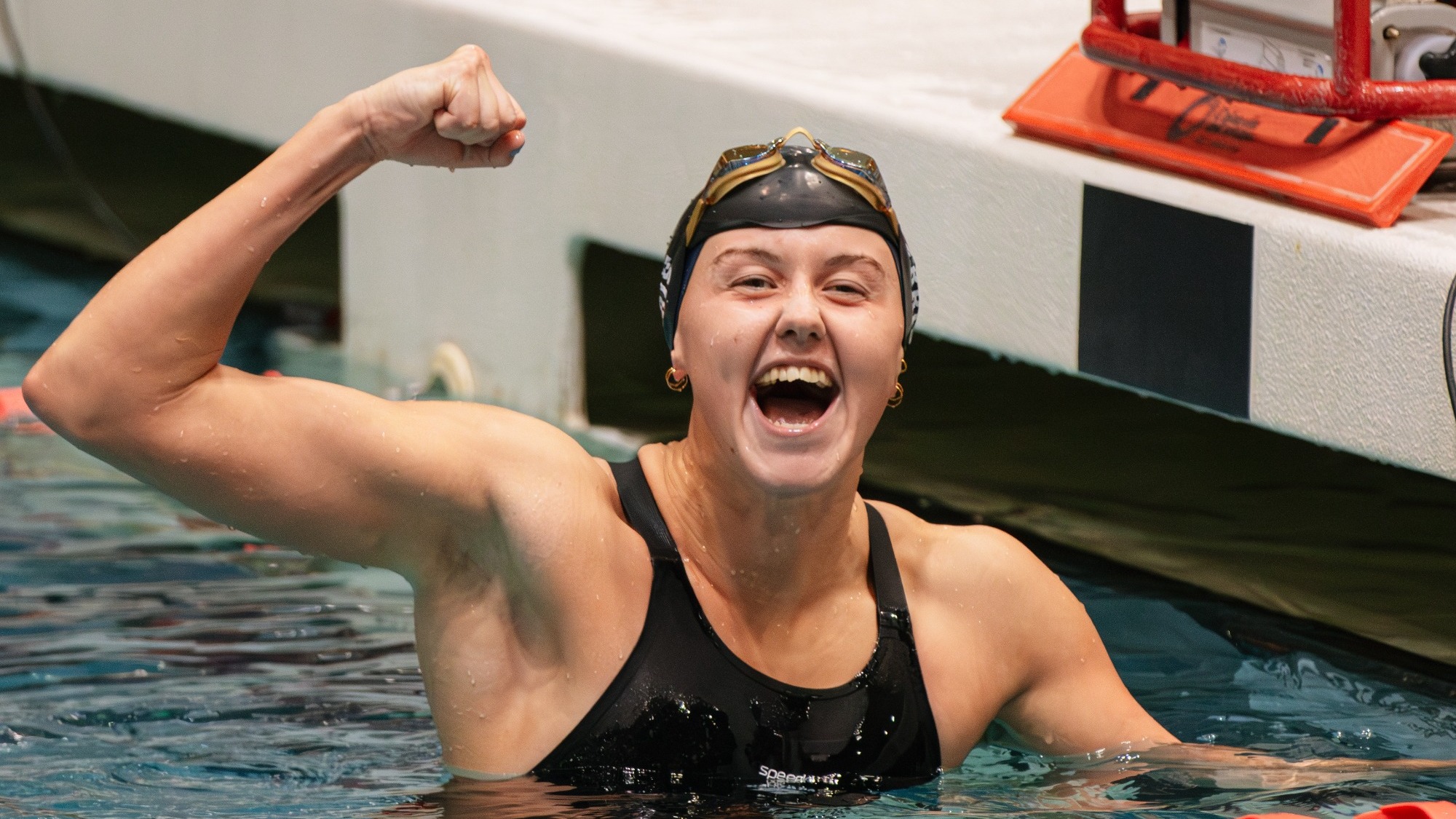 Scarlett wins 100 backstroke