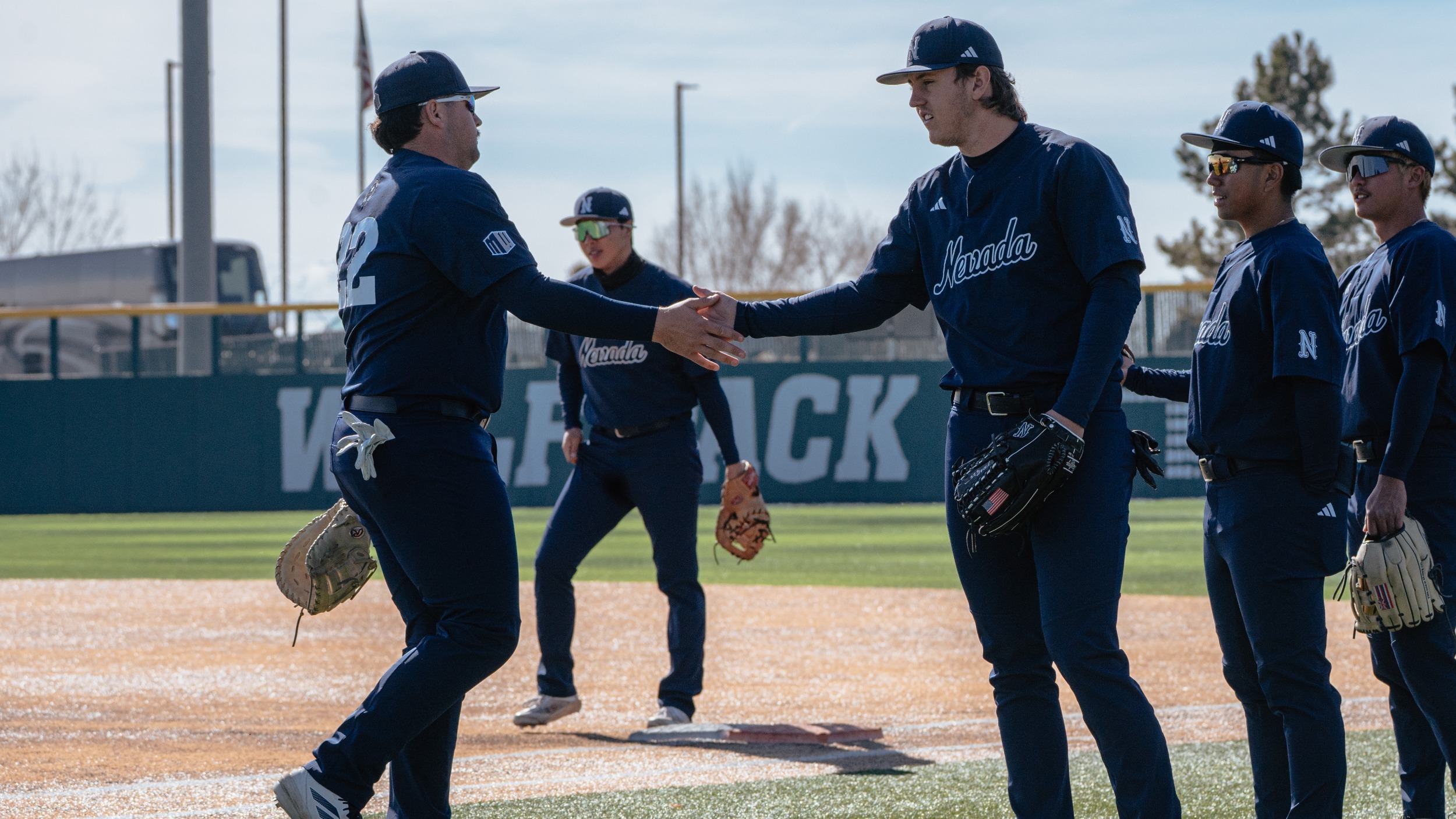 Mikey Cruz Jr. and Jacob Doyle shake hands pregame