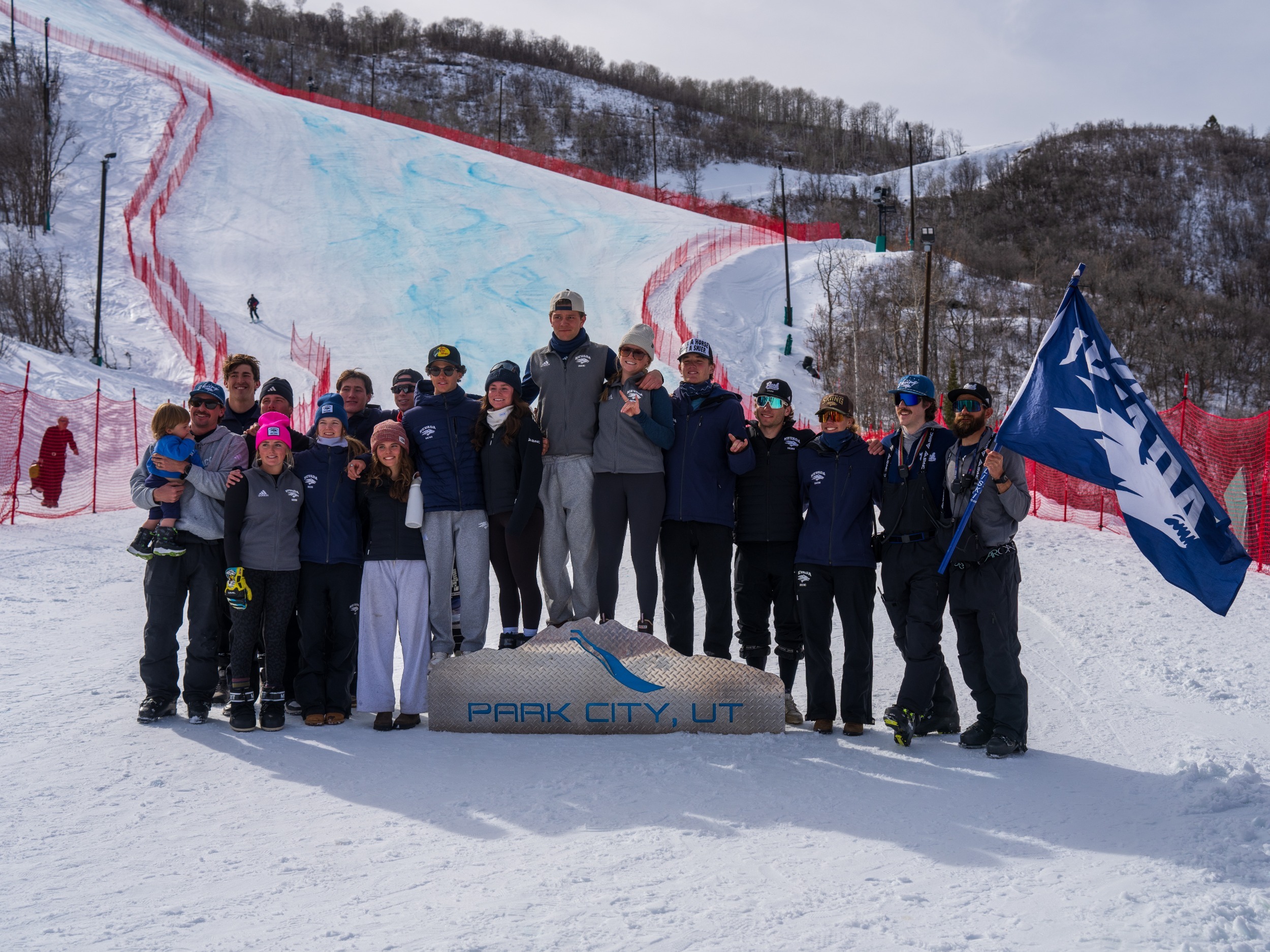 Nevada Ski team group photo on a podium that says UTAH OLYMPIC PARK