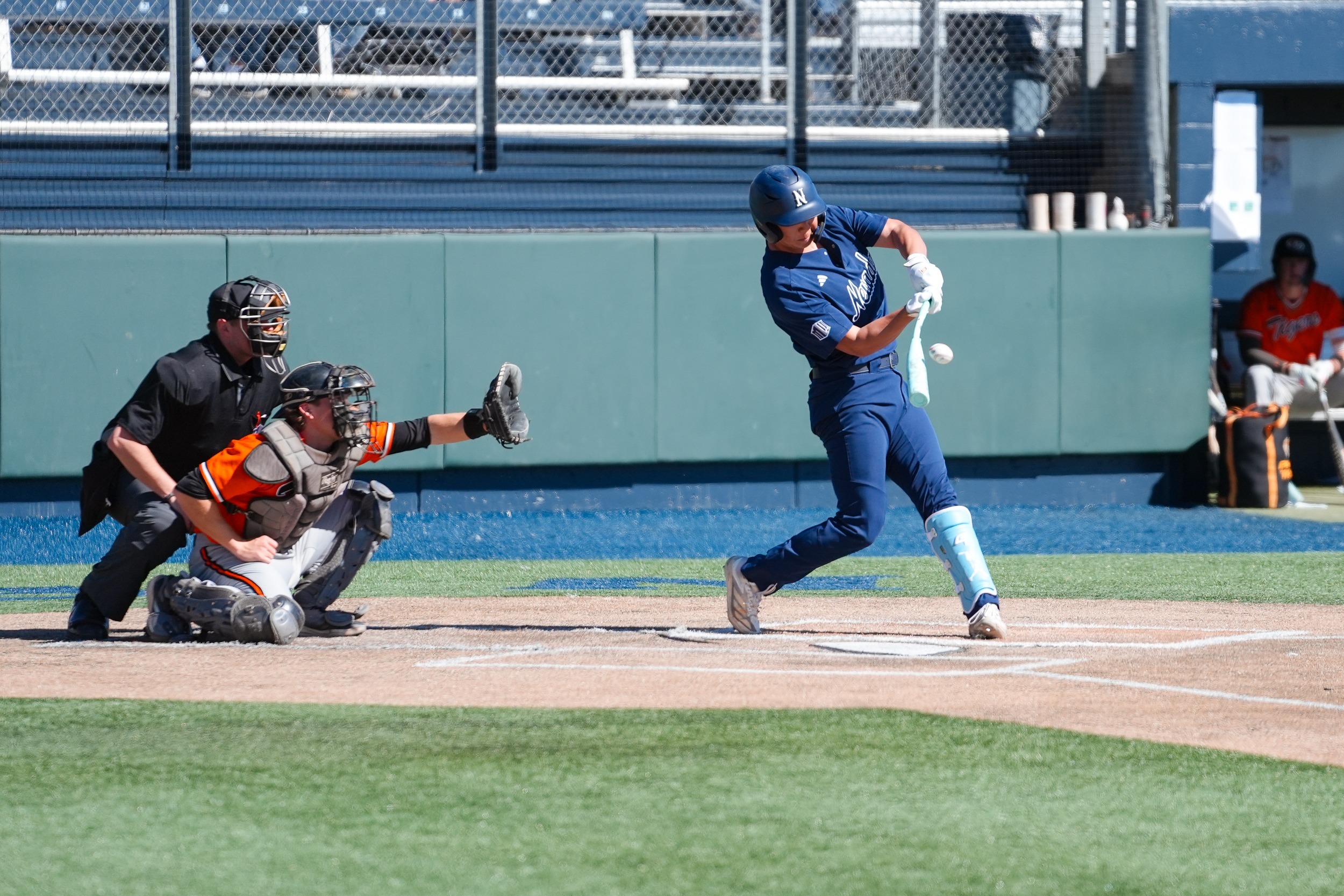Junhyuk Kwon swings and makes contact with a baseball