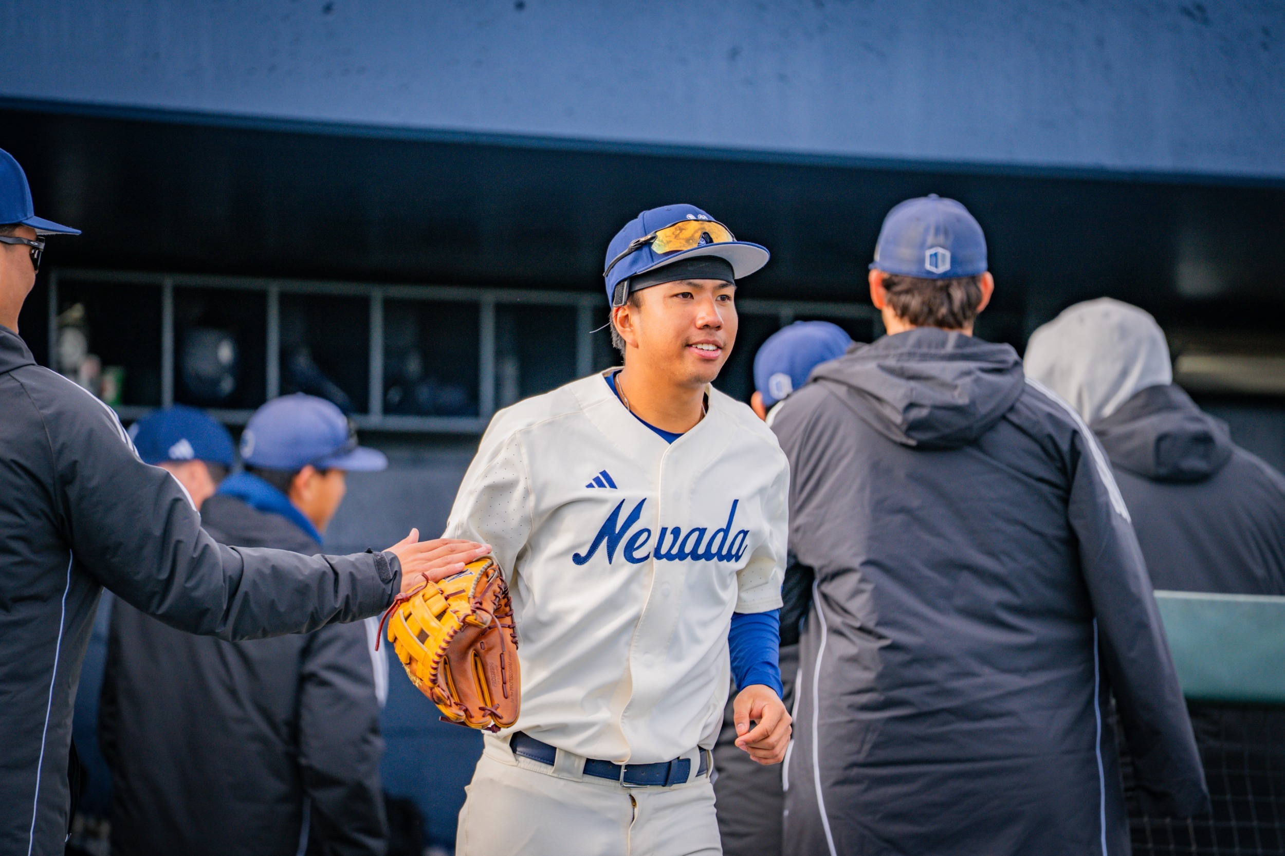 Rominic Quiban leaves the dugout to take his position pregame
