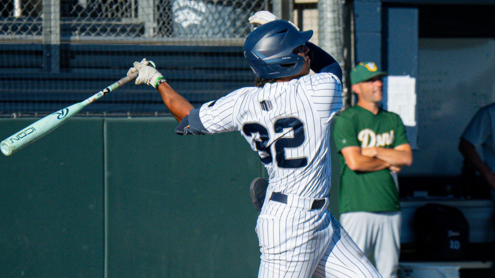 Jackson Waller in his backswing hitting a home run