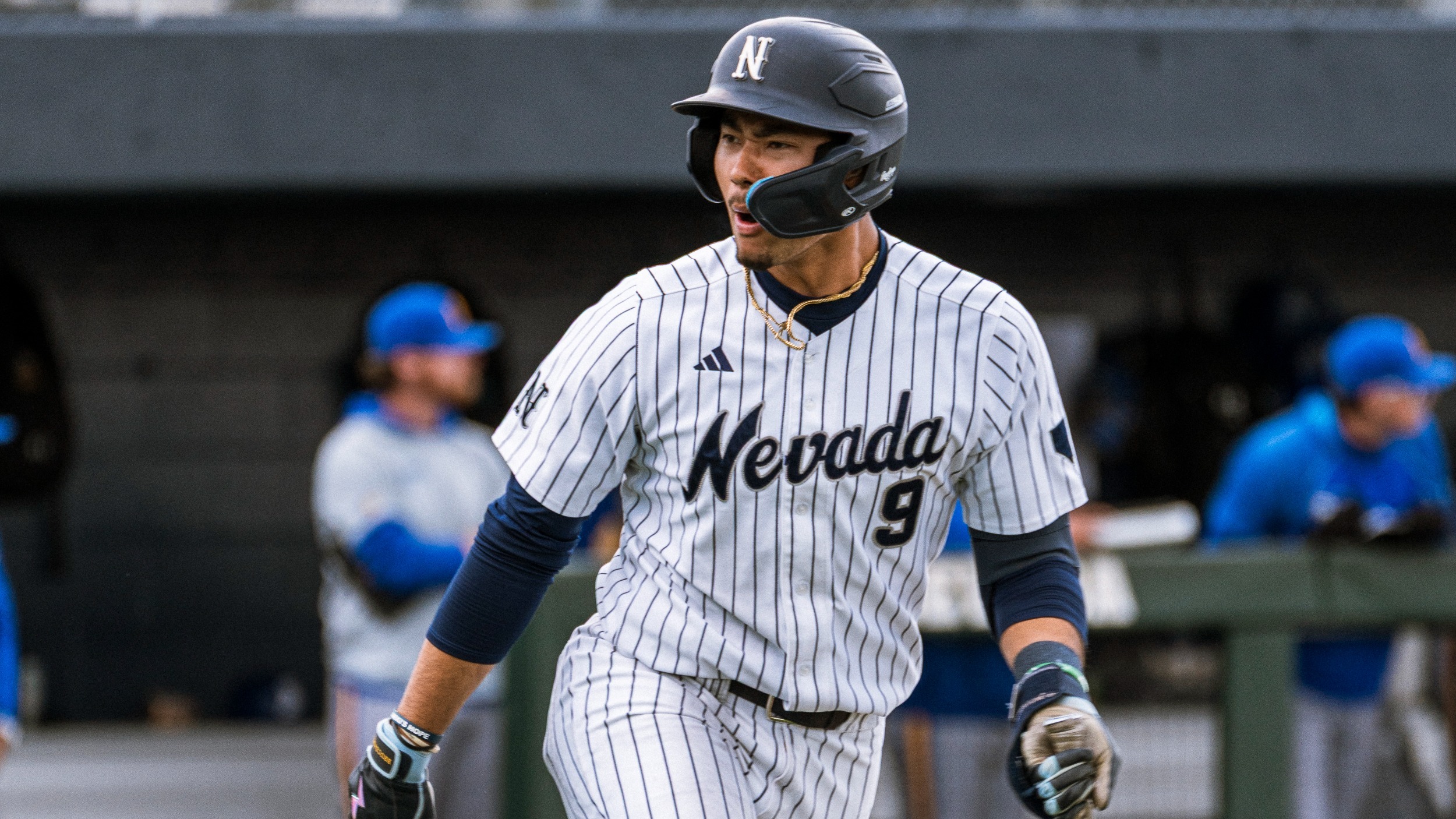 Jayce Dobie running down the first-base line celebrating a home run