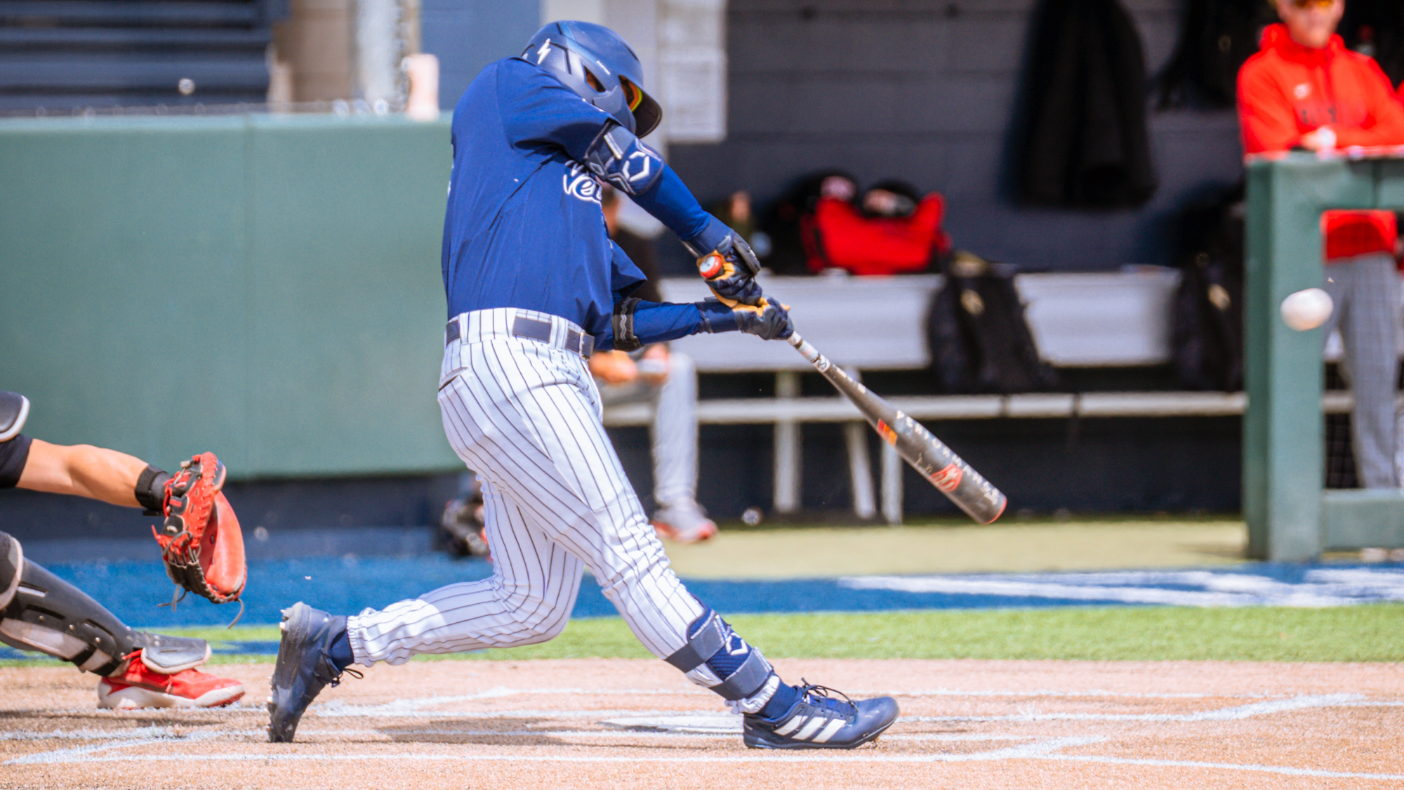 Rominic Quiban swings and connects with the baseball