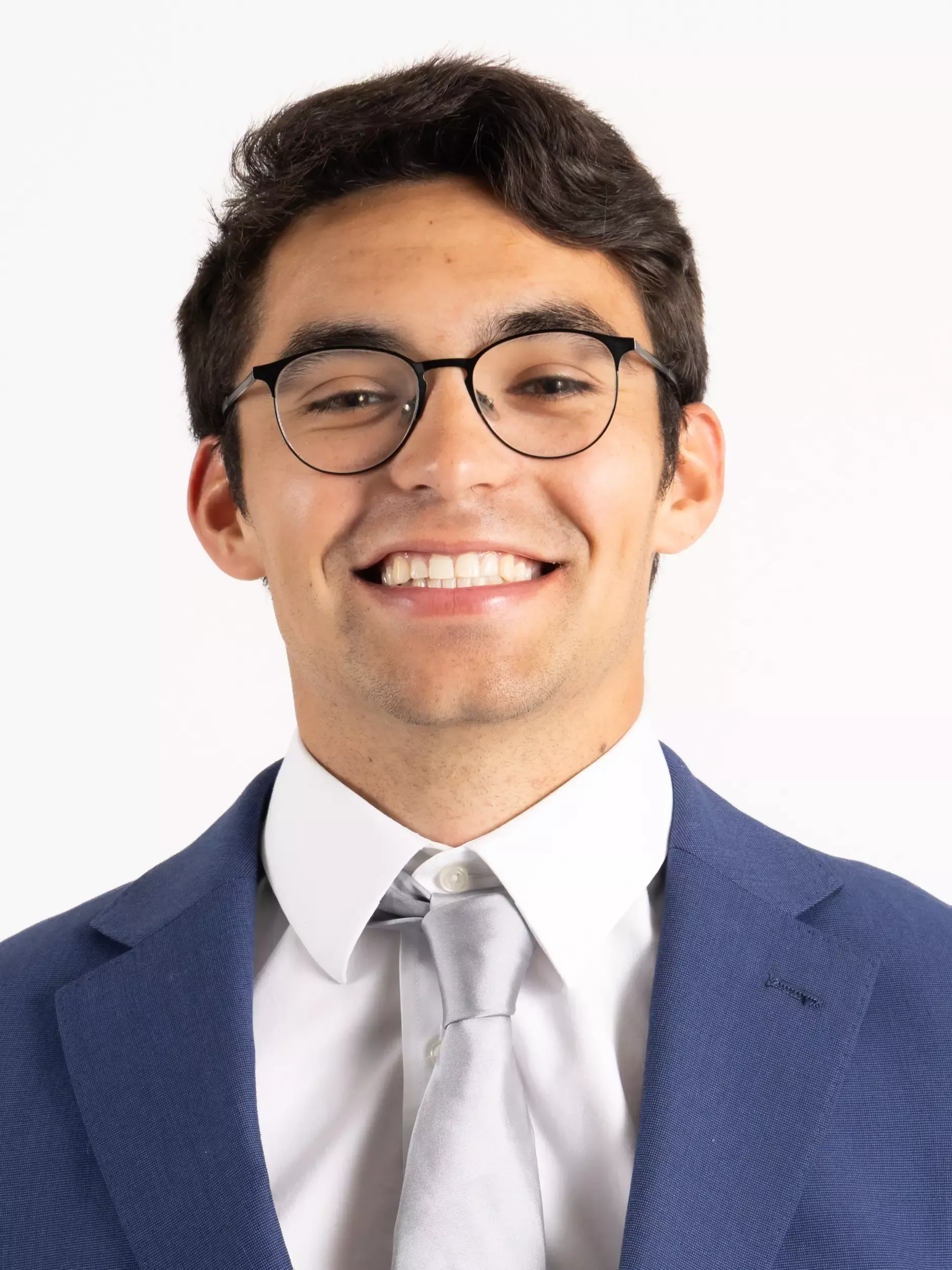 Brian Alexander headshot in coat and tie