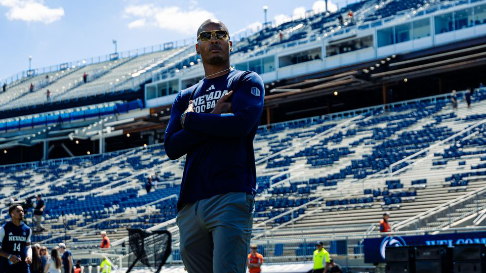 Joey Thomas walking on the football field pregame