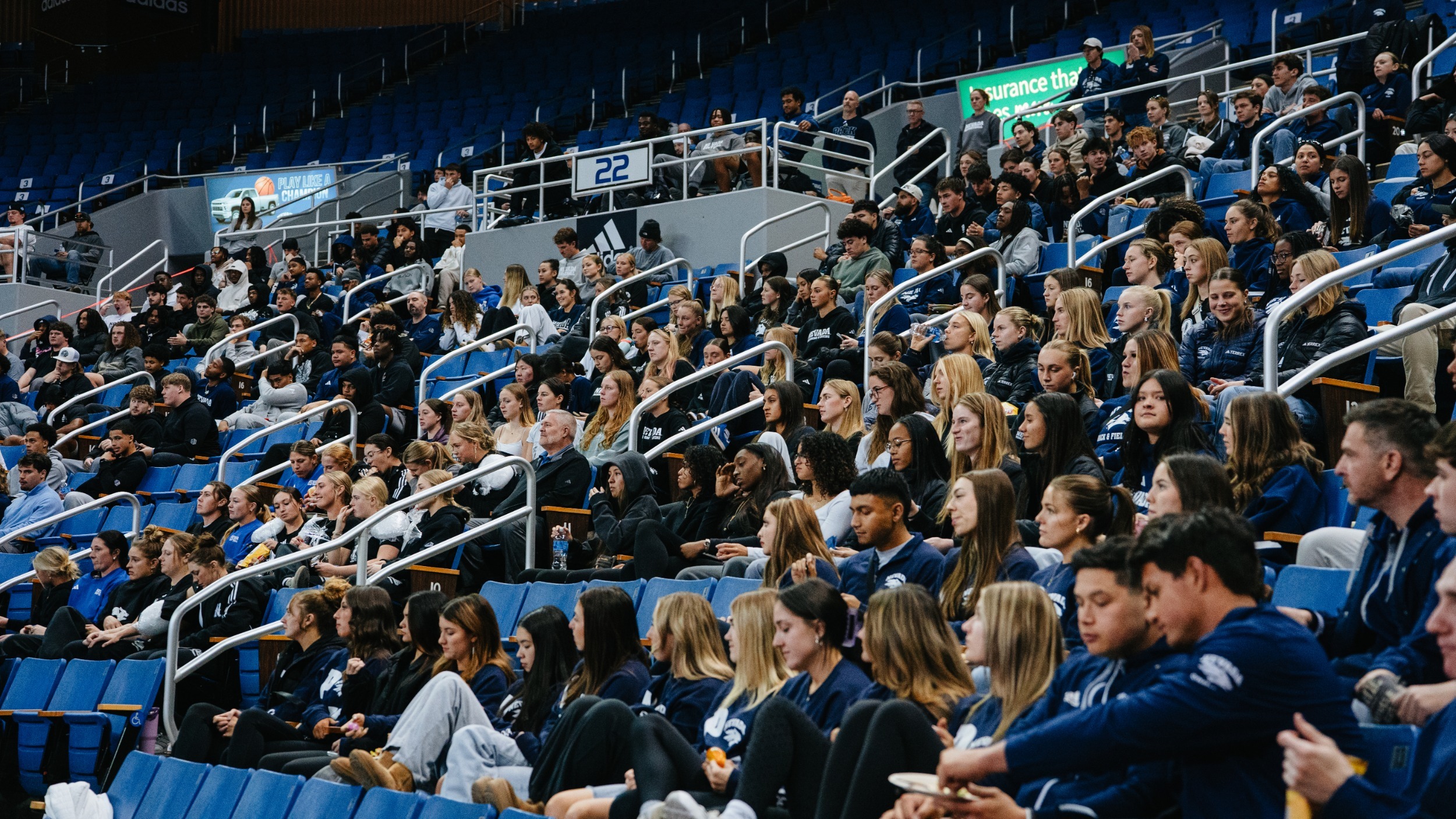 Nevada student-athletes sitting in the Lawlor Events Center stands