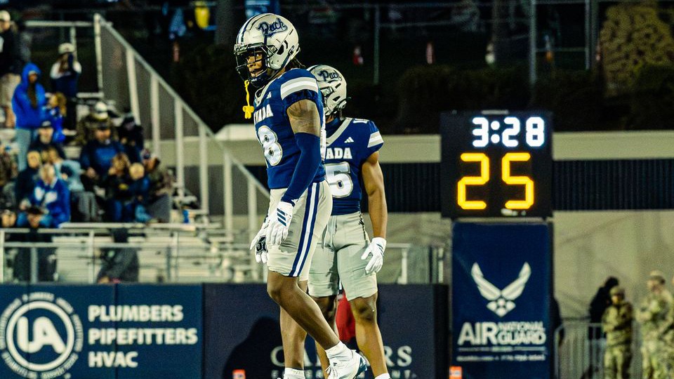 Aiden Walker celebrates a defensive football play