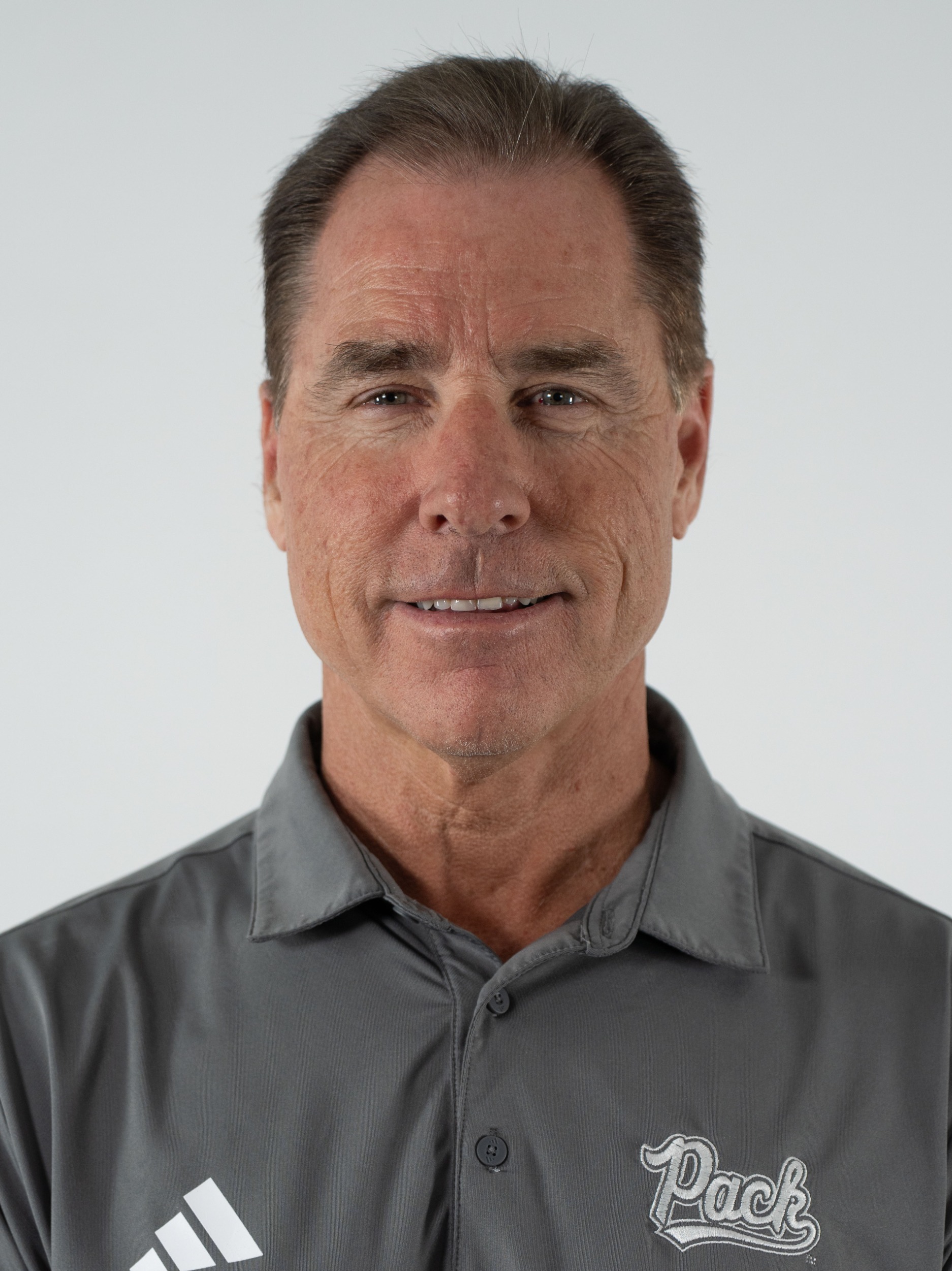 Headshot of Kelly Sopak in a light-colored polo shirt